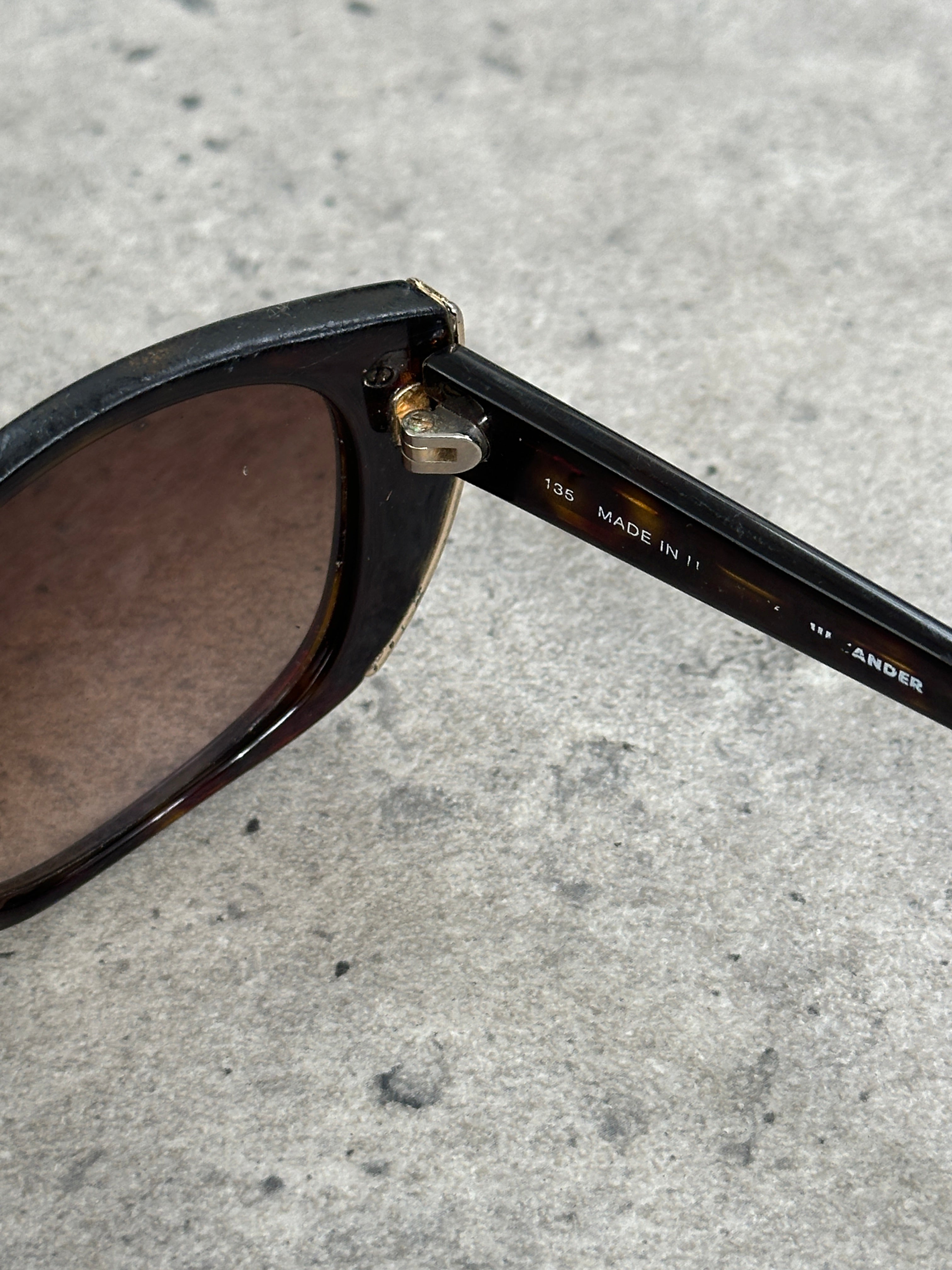 Jil Sander 2000s tortoiseshell rectangular logo sunglasses with bold frames and stylish design.
