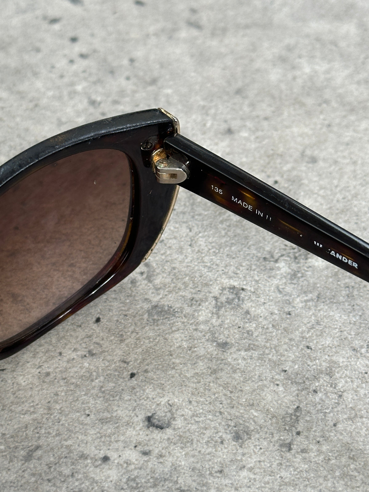 Jil Sander 2000s tortoiseshell rectangular logo sunglasses with bold frames and stylish design.