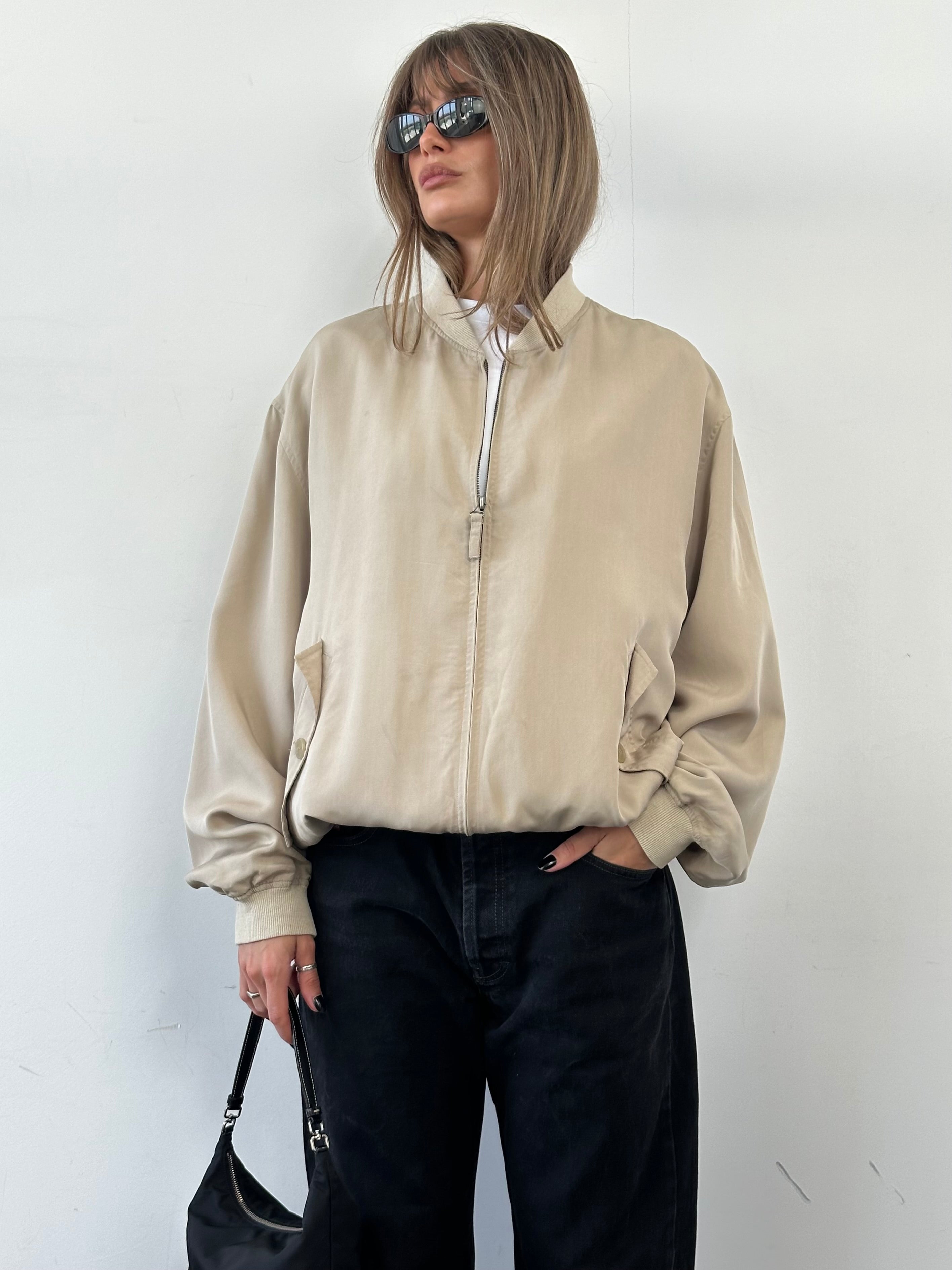 Vintage pure silk bomber jacket in XL, showcasing a classic design with smooth silk fabric and a stylish fit.