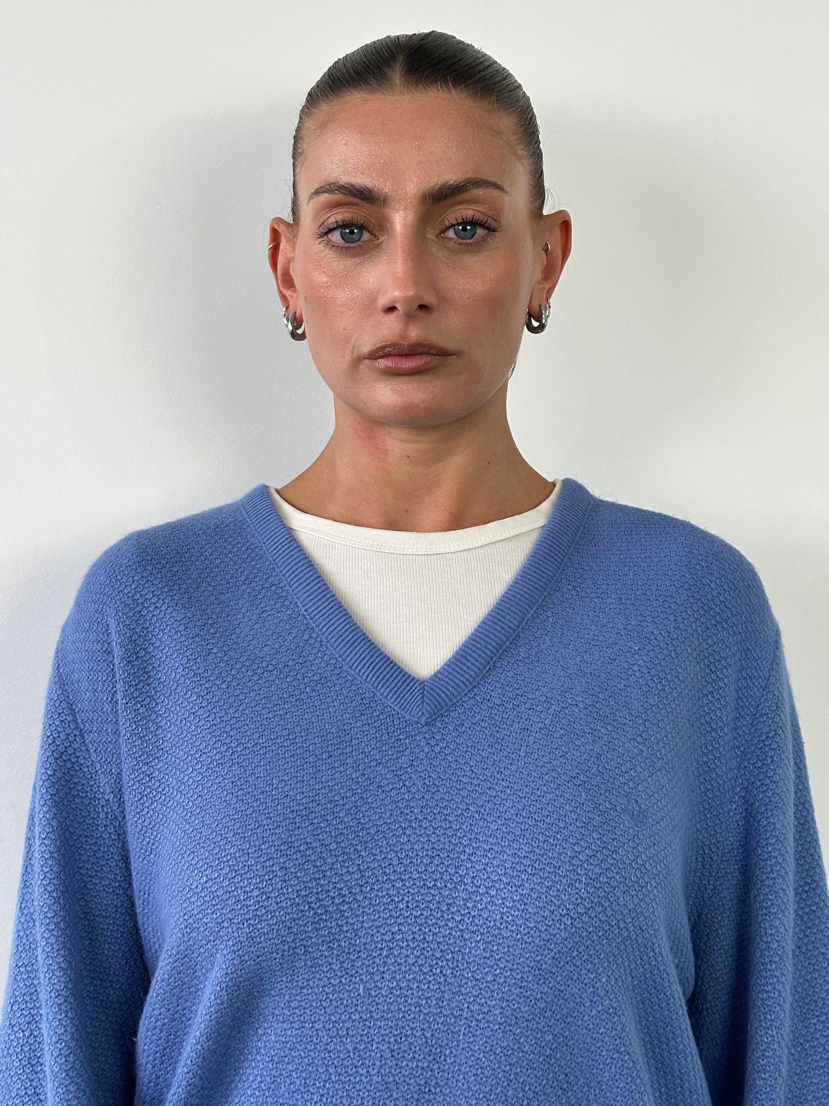 Christian Dior 1980s V-neck knitted logo jumper in large size, featuring classic Dior branding and a cozy knit texture.