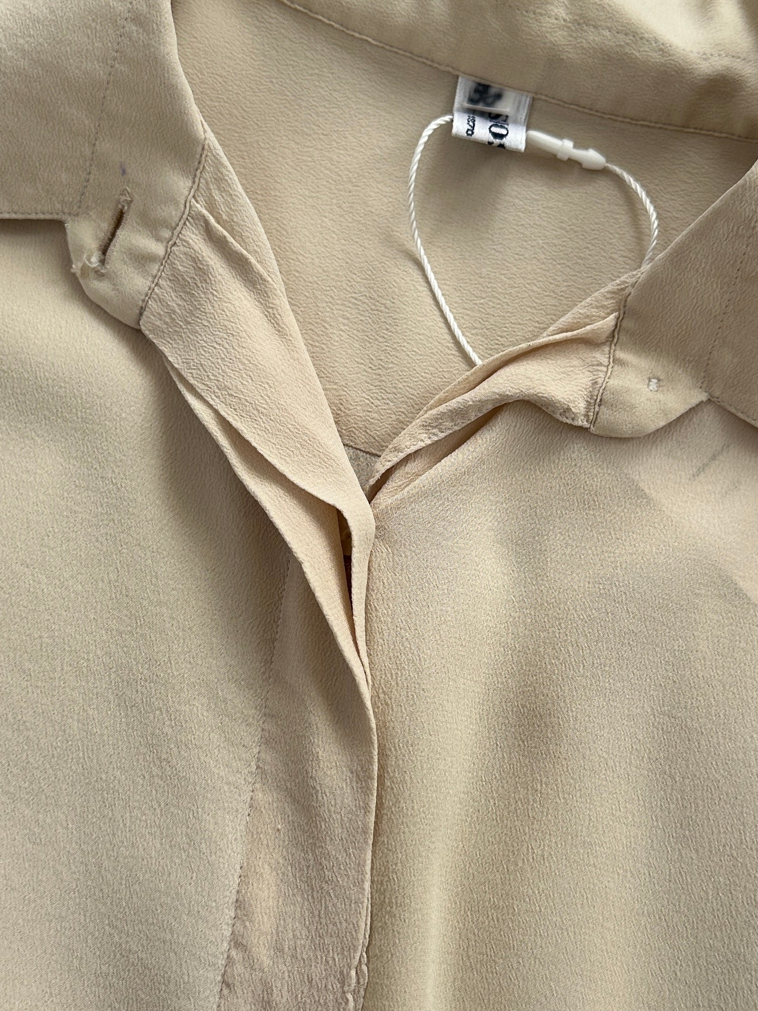 Vintage Italian vintage pure silk blouse with concealed placket, short sleeves, and elegant design, size small.