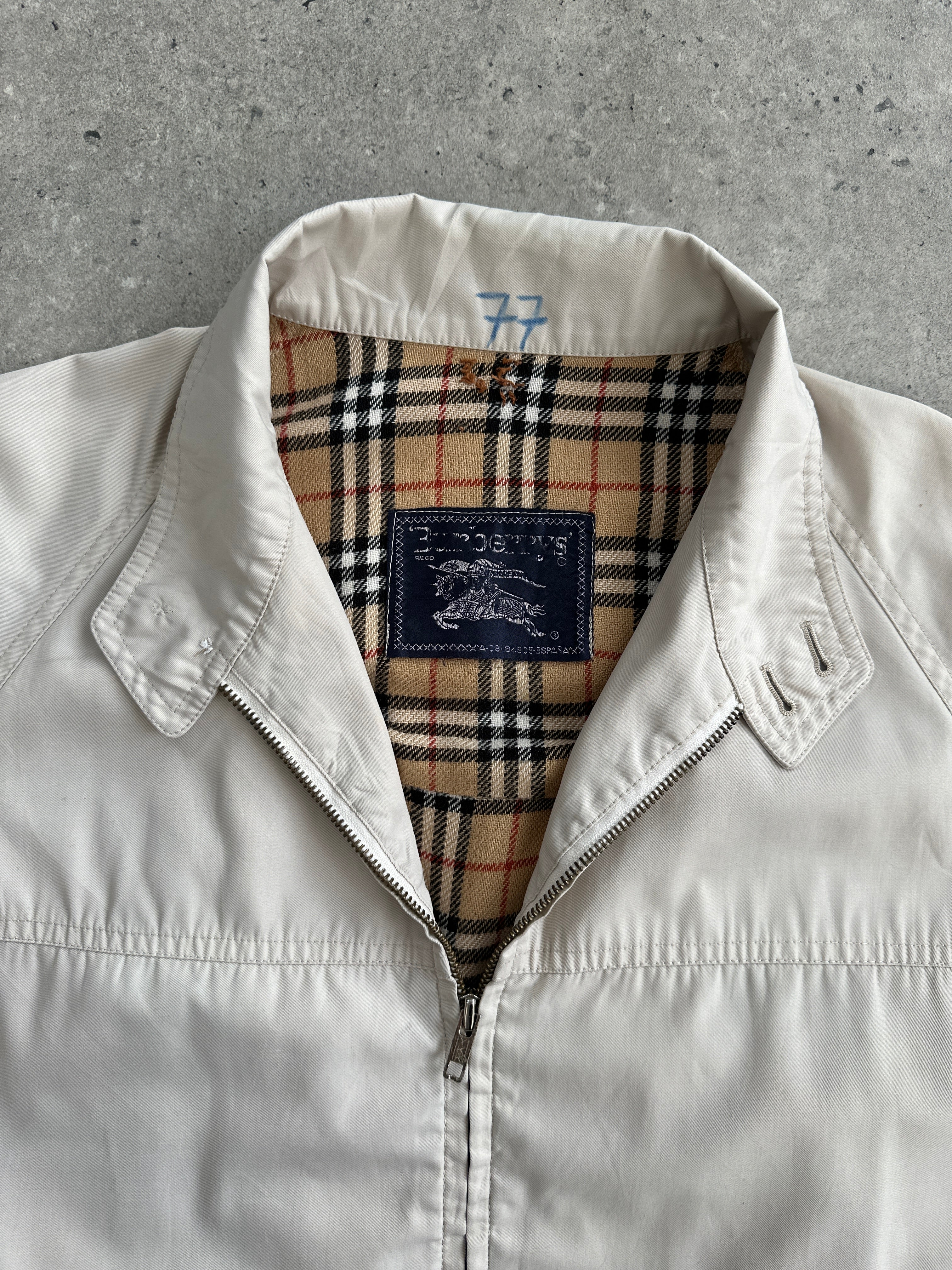 Burberry Nova Check logo bomber jacket in size L, featuring signature check pattern and classic design.