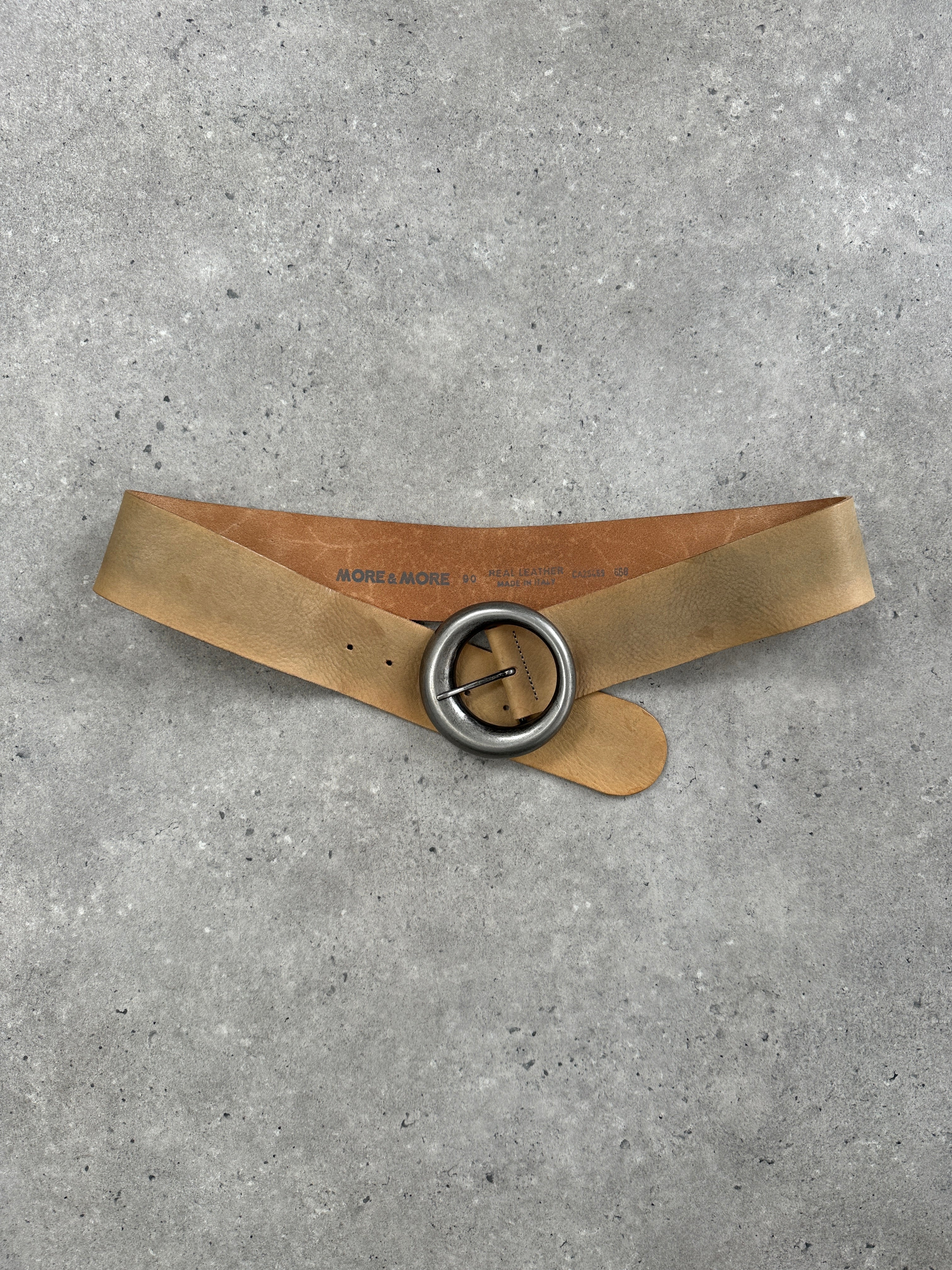 Vintage 1990s circular buckle leather belt in brown with adjustable W32-36 size, featuring classic retro style.