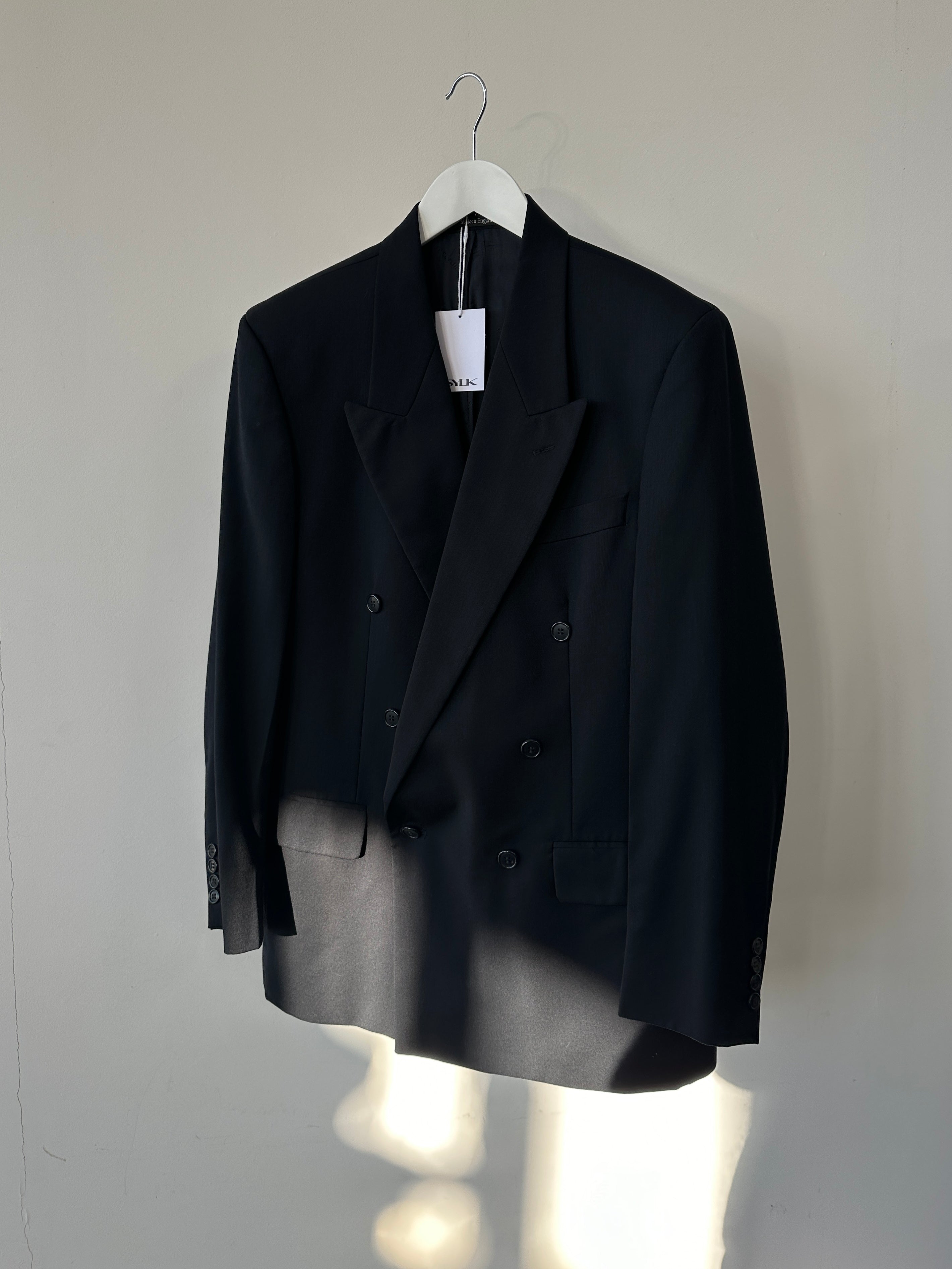 Pierre Cardin pure wool double-breasted blazer in size 40R/L, featuring classic lapels and tailored fit, shown on a hanger.