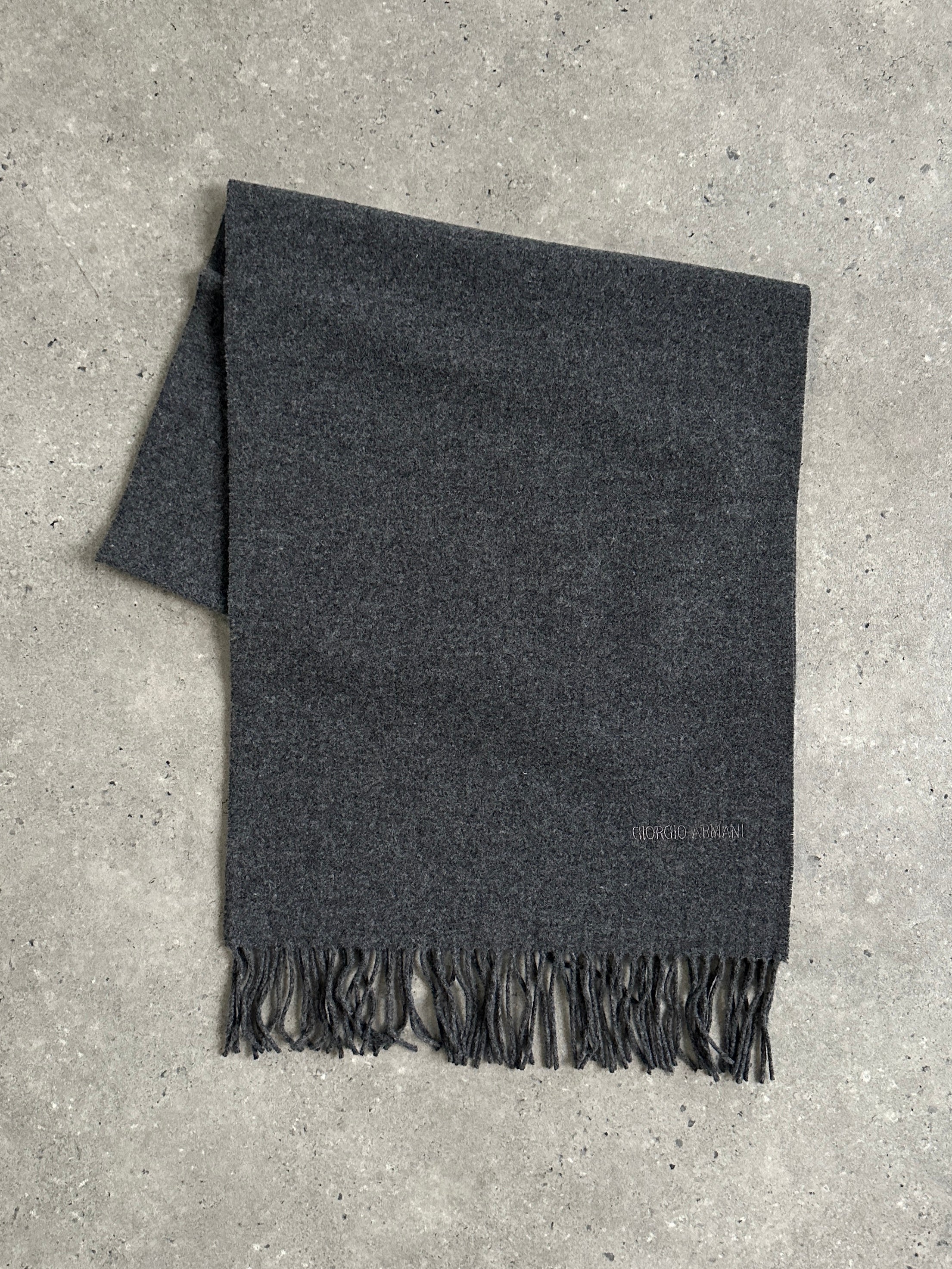 Giorgio Armani Le Collezioni pure wool logo scarf in neutral tones, featuring subtle Armani branding and soft, woven texture.