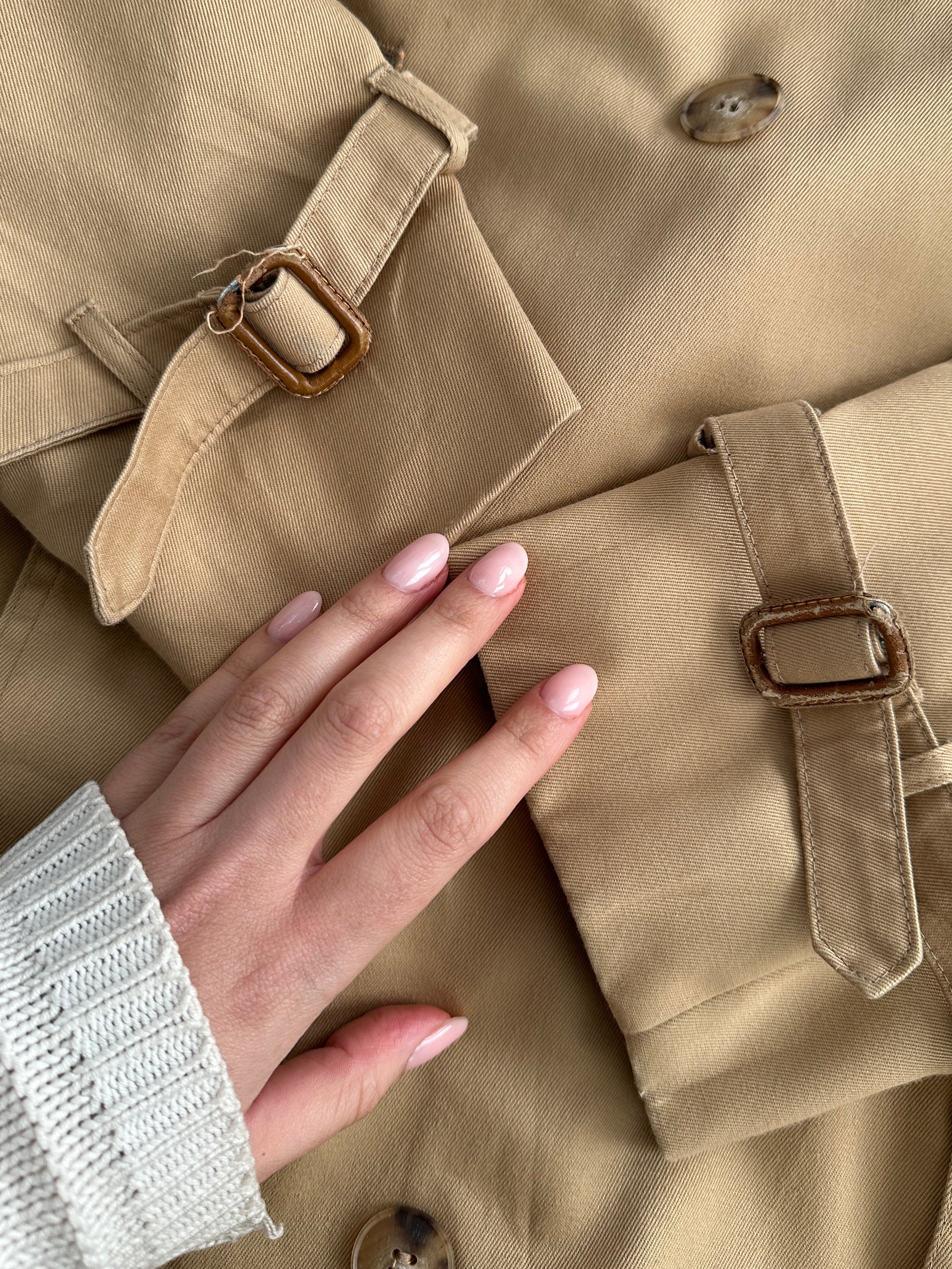 Christian Dior cotton double-breasted trench coat in size L/XL, showcasing classic design with a stylish belt and button details.
