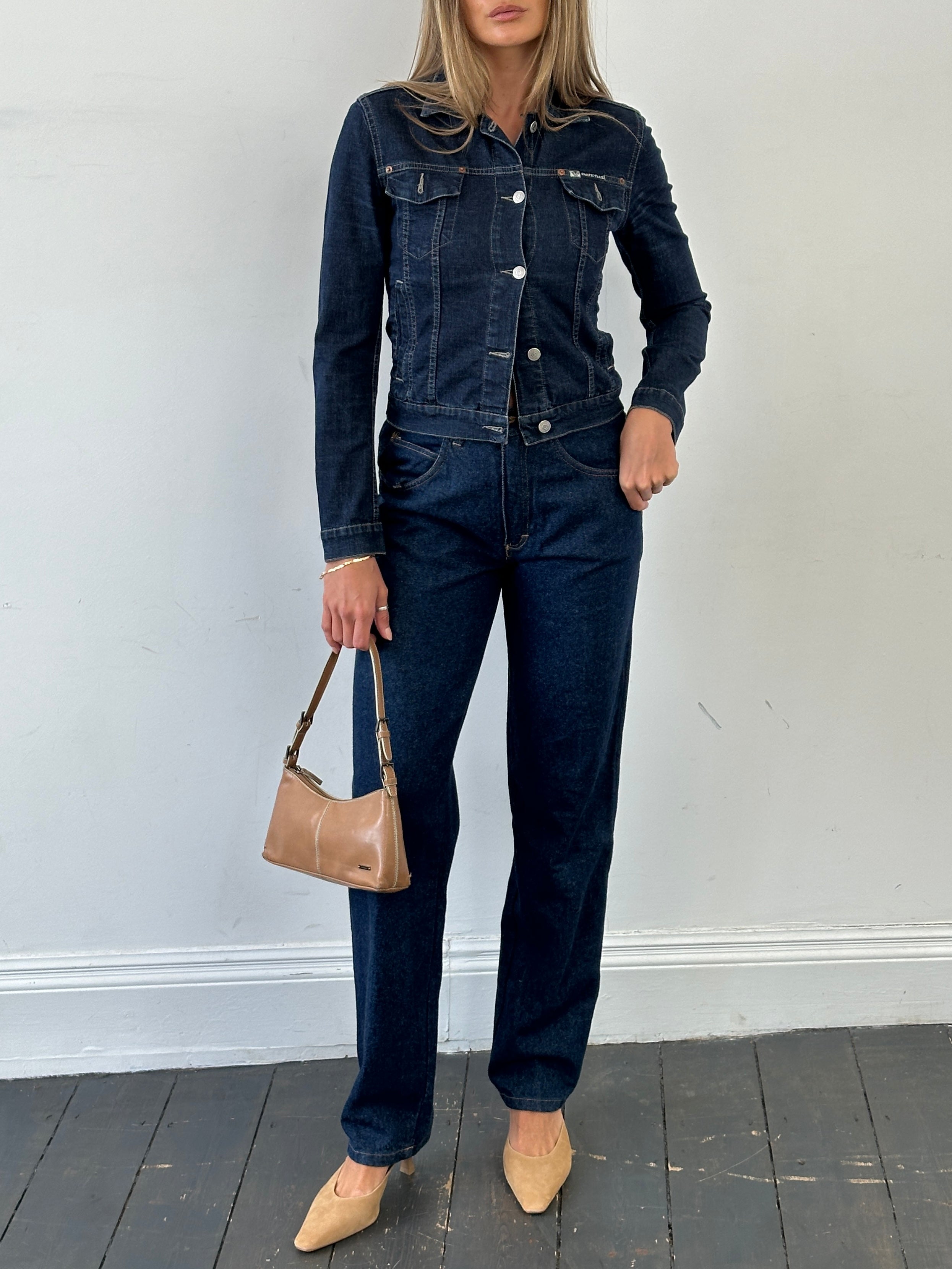 Vintage high waisted straight leg denim jeans in W26, showing classic blue denim fabric and vintage style details