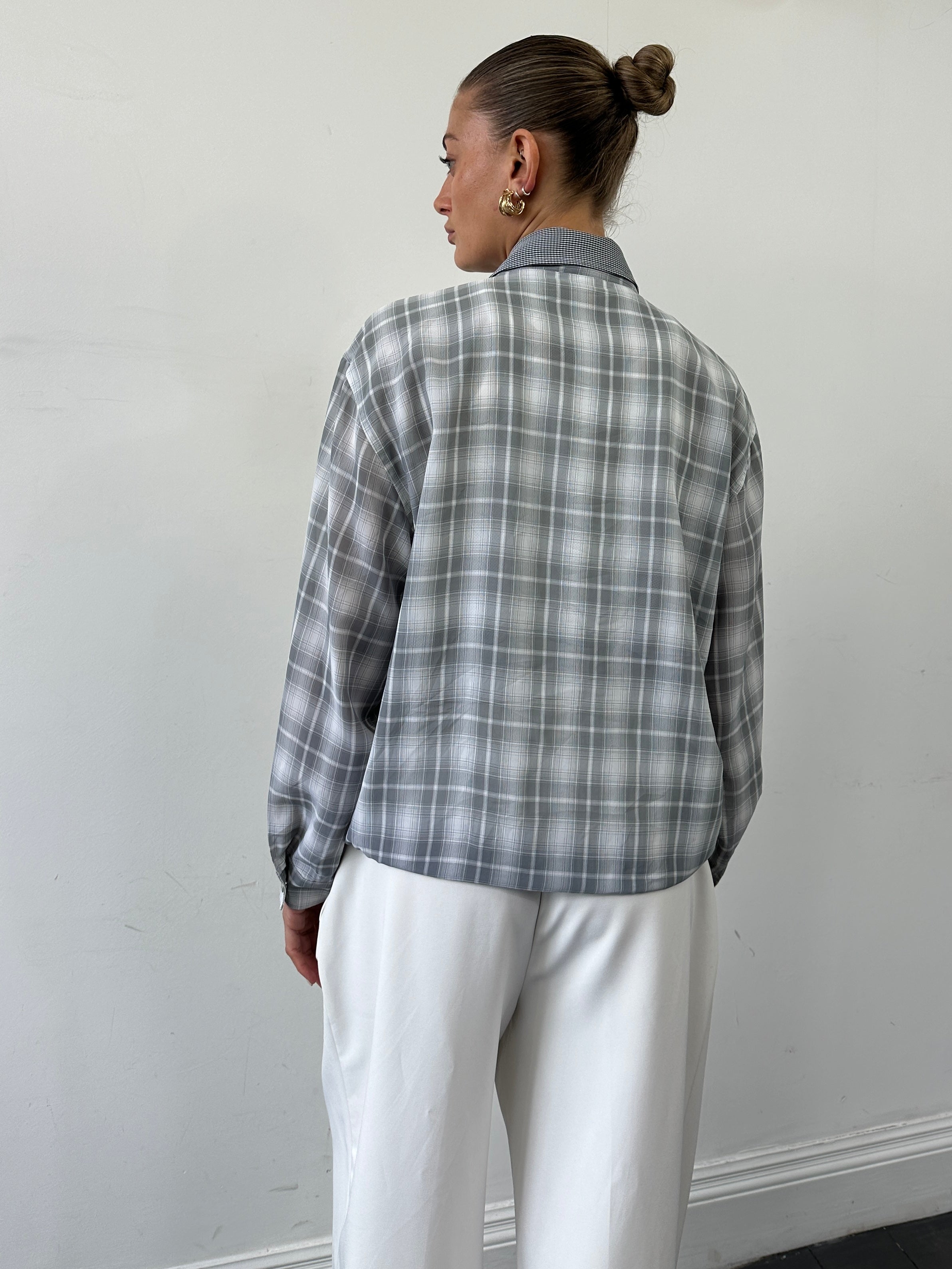 Yves Saint Laurent Pour Homme check logo bomber jacket in size M, black with signature YSL branding and checkered pattern.