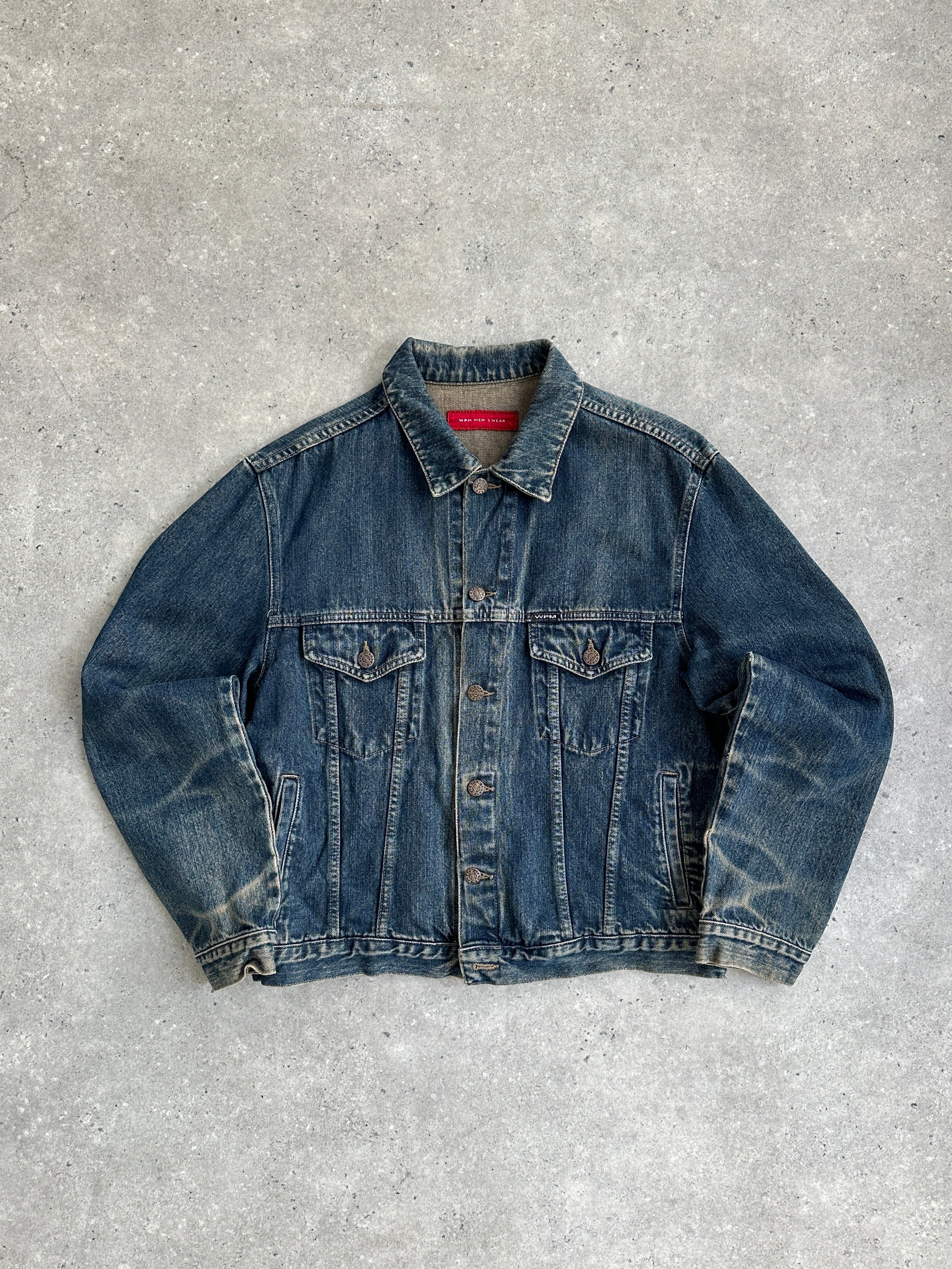 Vintage Italian washed denim jacket, M/L size, featuring classic stitching and distressed details, casual outerwear for everyday wear.
