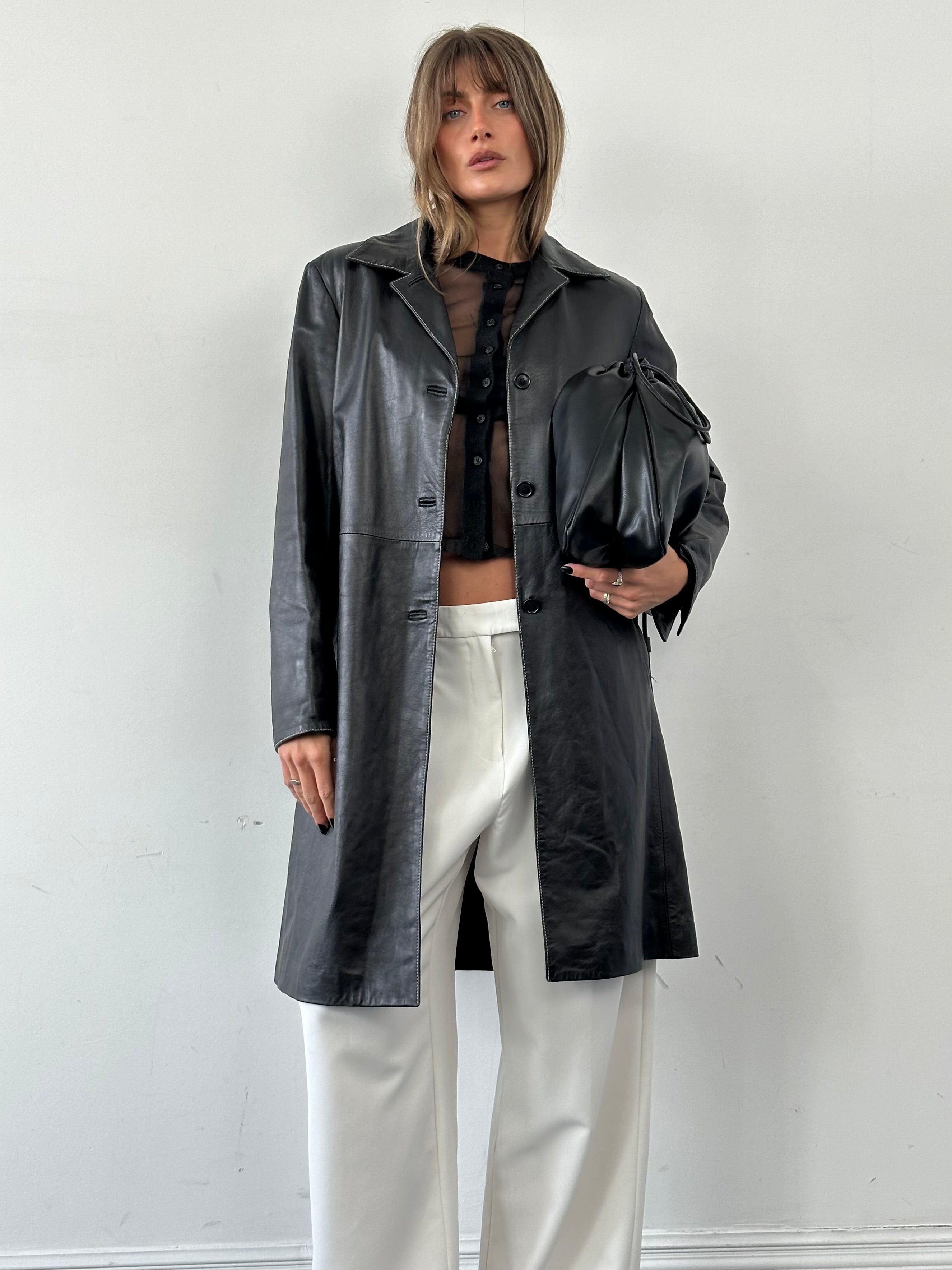 Conbipel contrast stitch leather trench coat for women, featuring tailored fit, lapel collar, and stylish design.