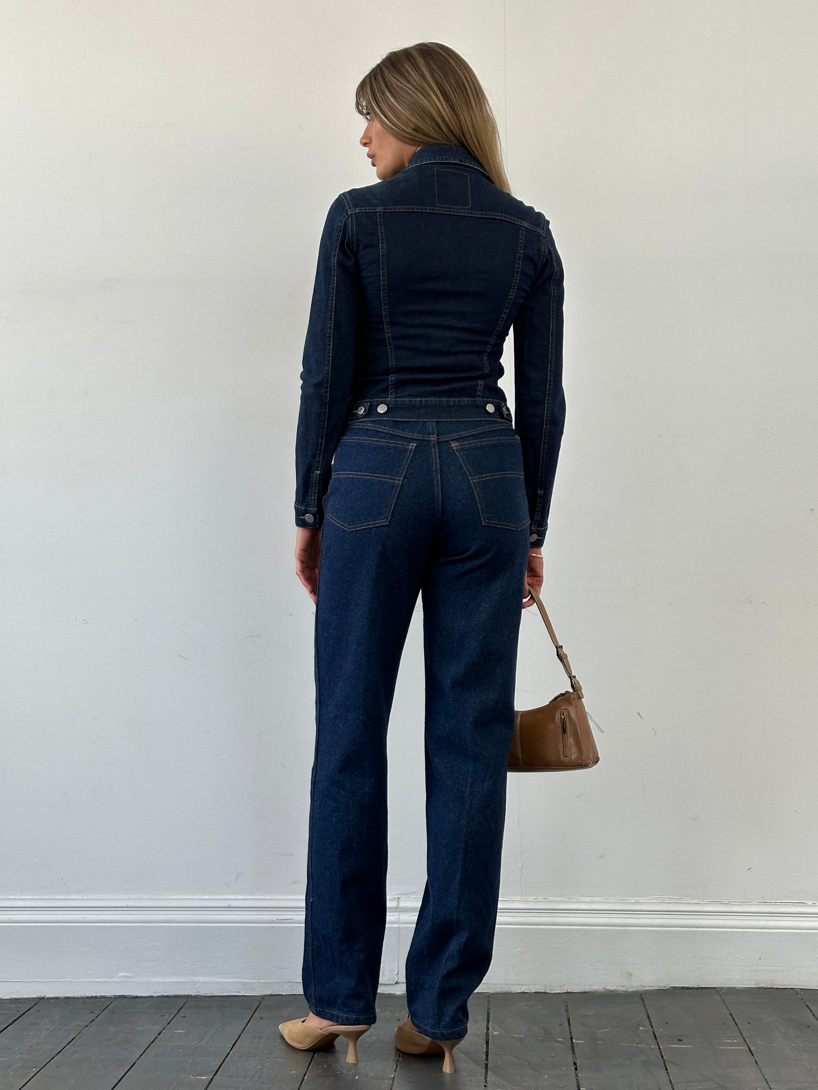 Vintage high waisted straight leg denim jeans, W26, showing front view with classic blue wash and subtle fading.