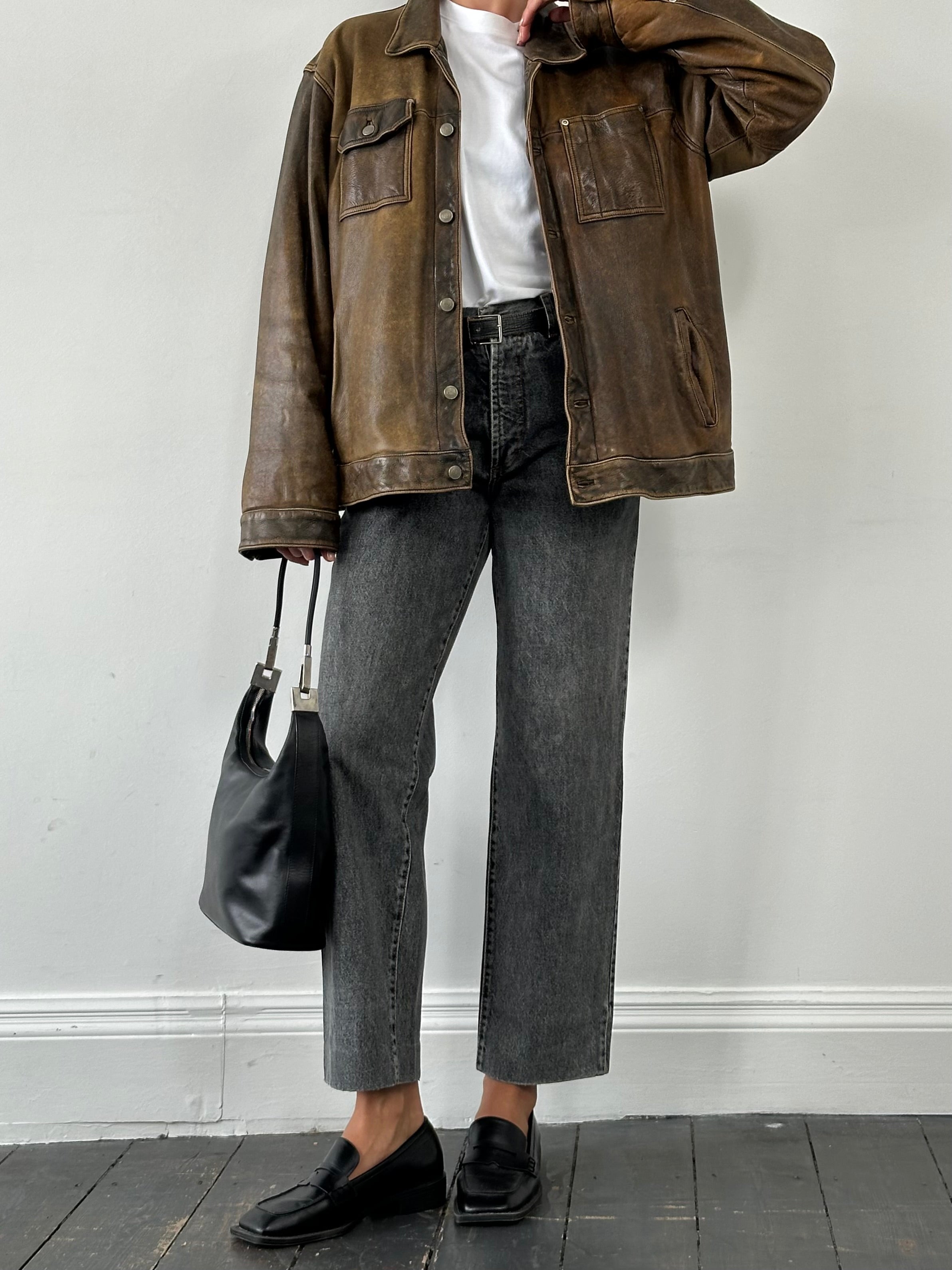 Vintage Italian 1990s high-waisted straight leg denim jeans, W28, featuring classic blue wash and vintage design details.