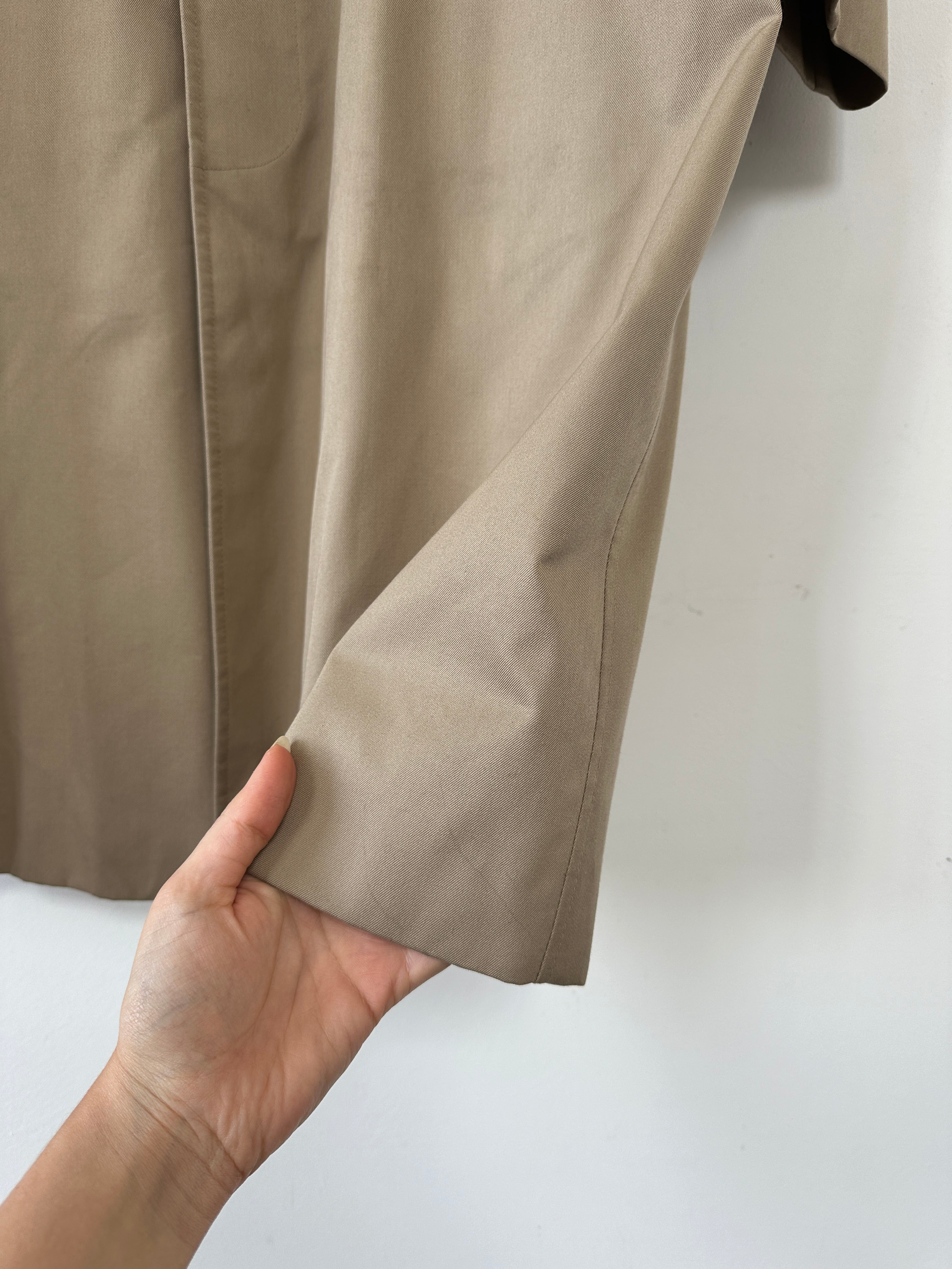 Aquascutum cotton trench coat with concealed placket, XL size, classic design, beige color, tailored fit, and durable fabric.