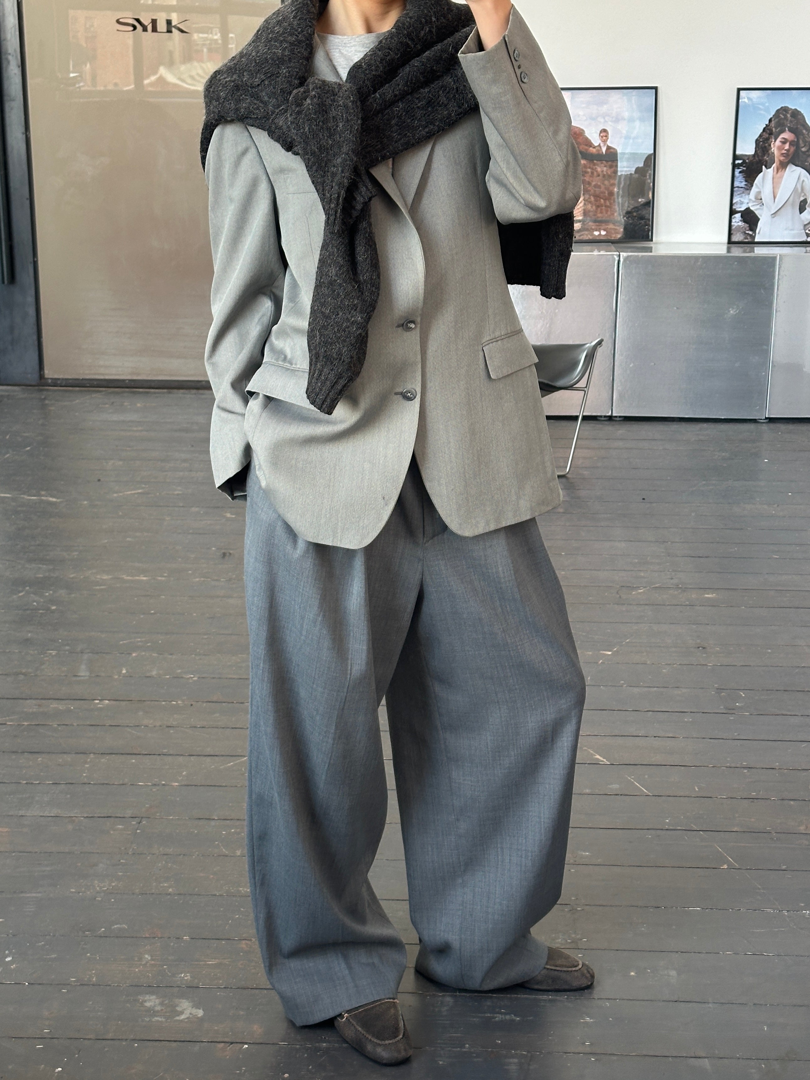 Yves Saint Laurent 1990s pure wool single-breasted blazer in size 40R/L, shown in a tailored fit with classic lapels.