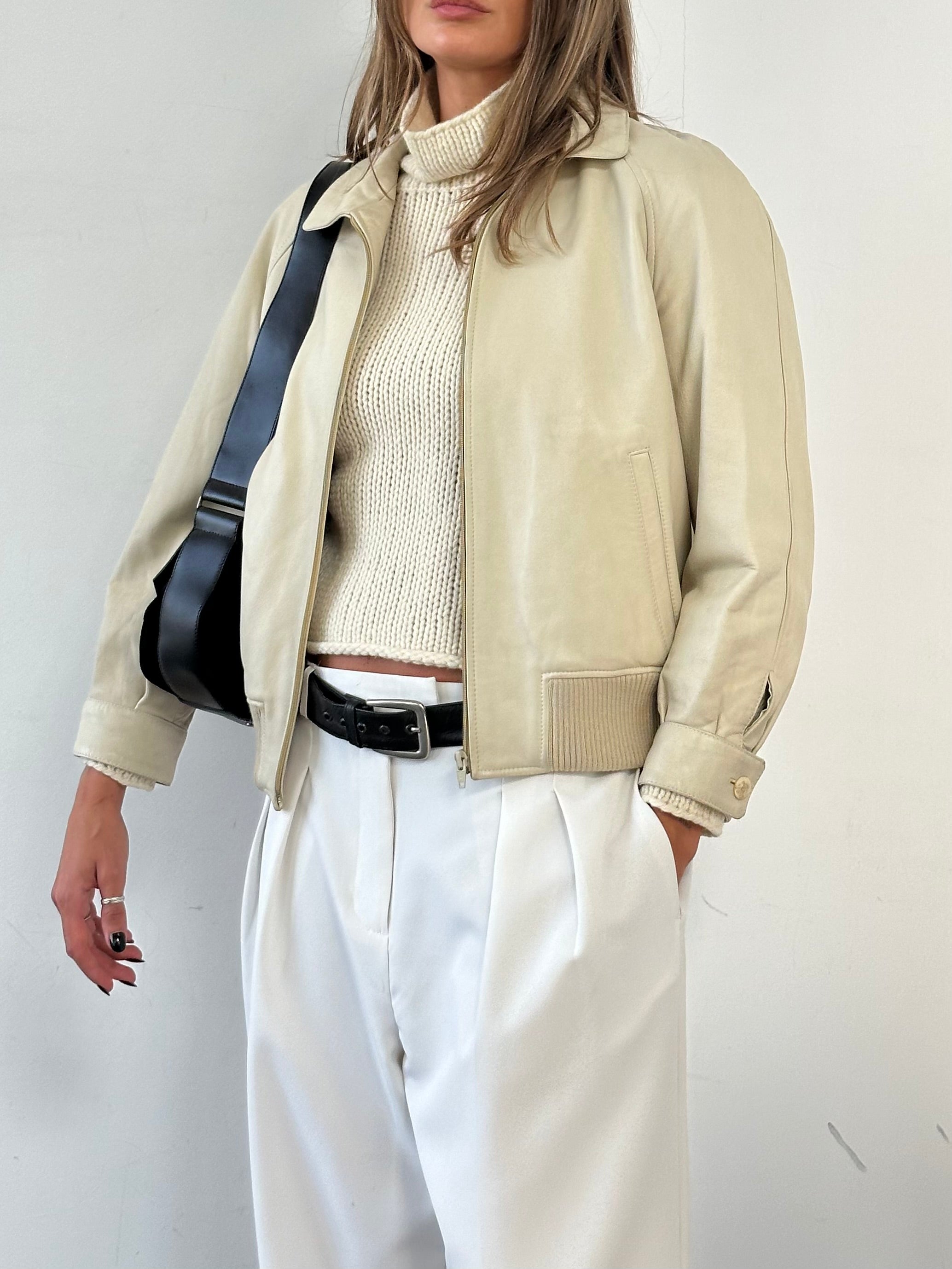 Vintage leather bomber jacket for men, size small, featuring classic design and durable leather material.