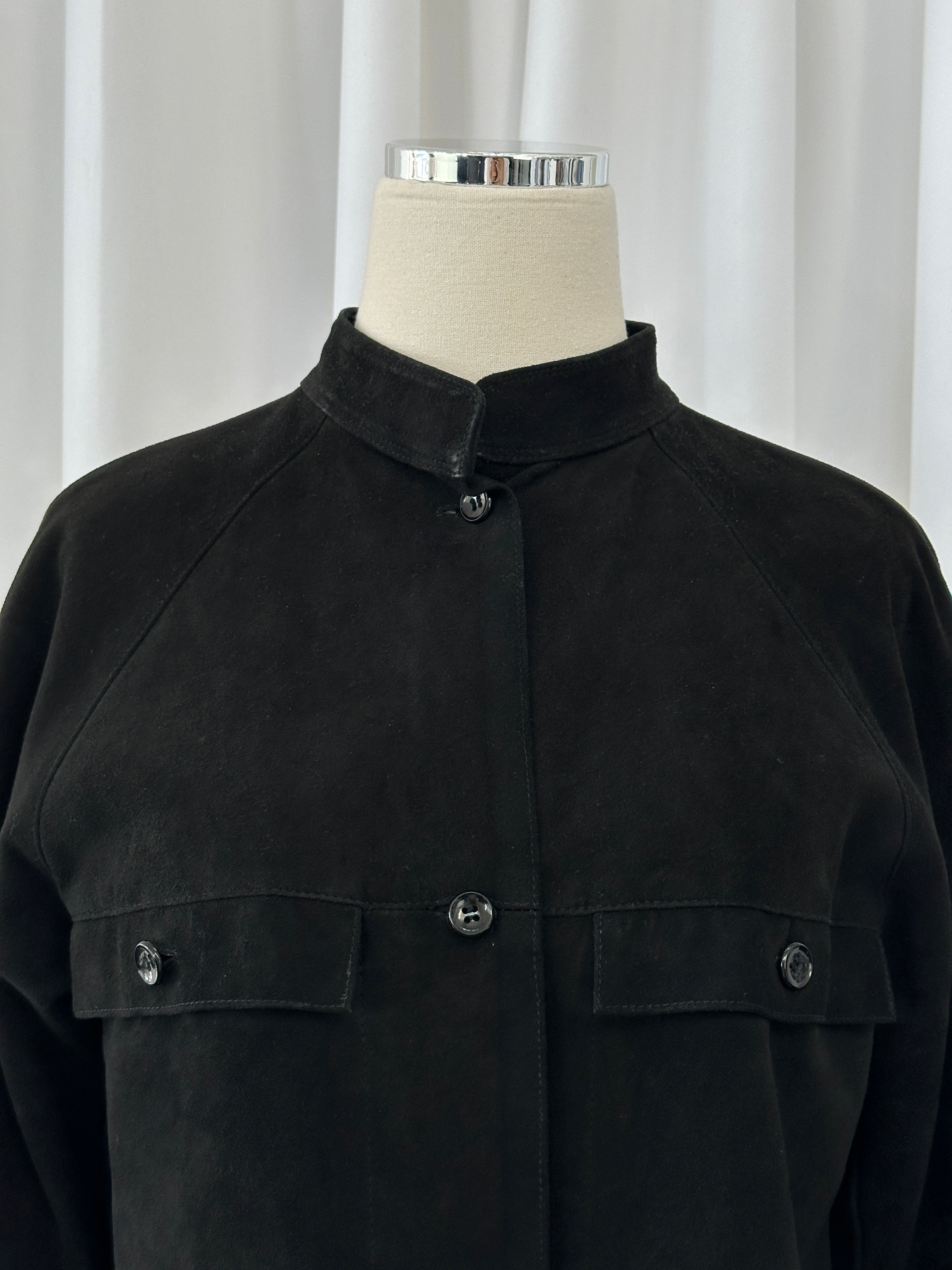 Gianni Versace x Beged-Or 1970s suede shirt in a classic design, shown in a close-up image highlighting texture and style.
