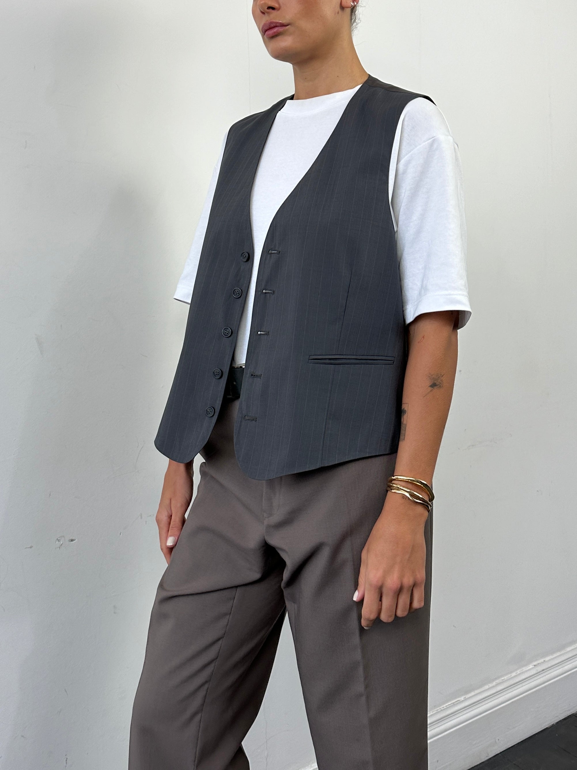 Vintage 1990s striped tailored waistcoat in size large, featuring classic retro style and fitted design.