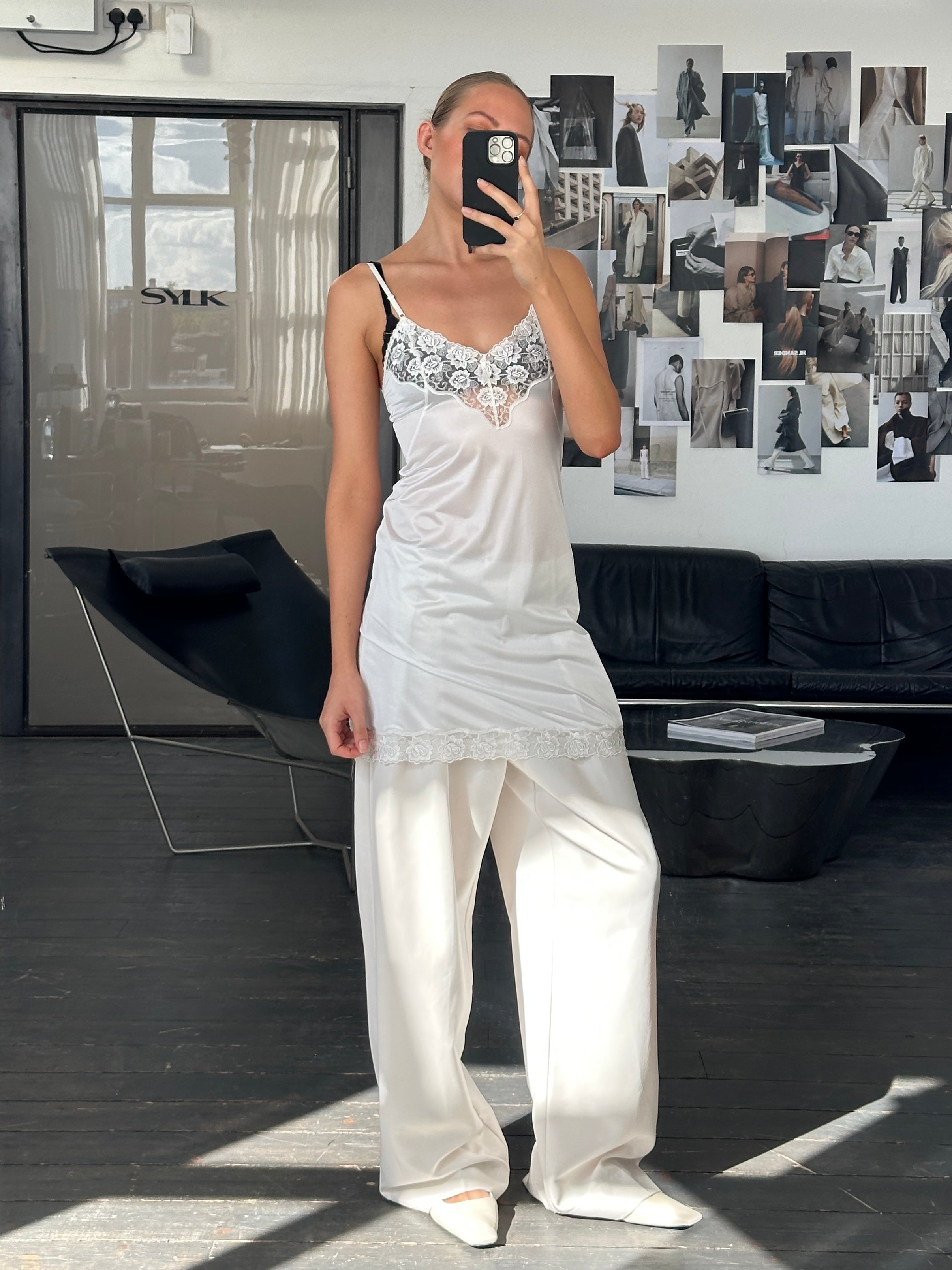Vintage 1990s lace sheer mini slip dress in size small, featuring delicate lace fabric and a vintage-inspired design.