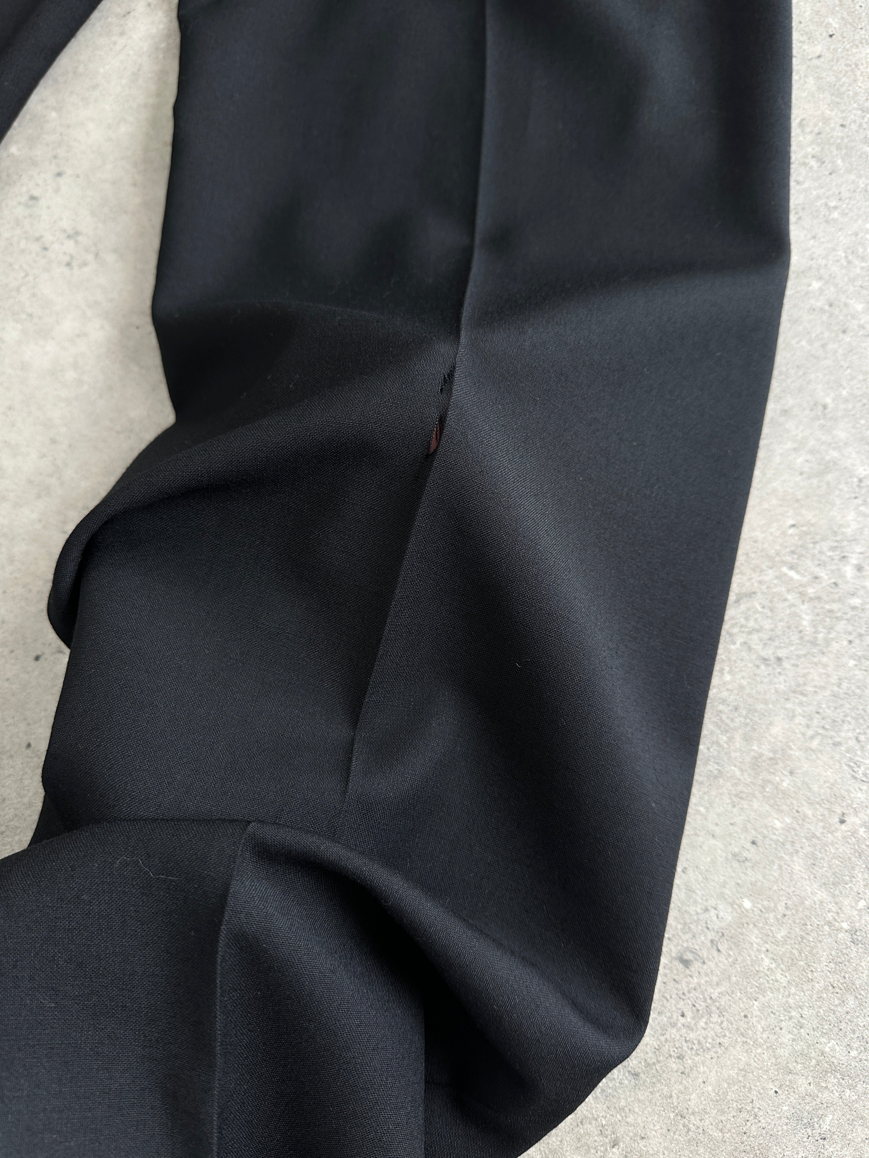 Vintage Italian vintage pure wool straight-leg tailored trousers with raw hem, W34, showing classic fit and textured fabric detail.