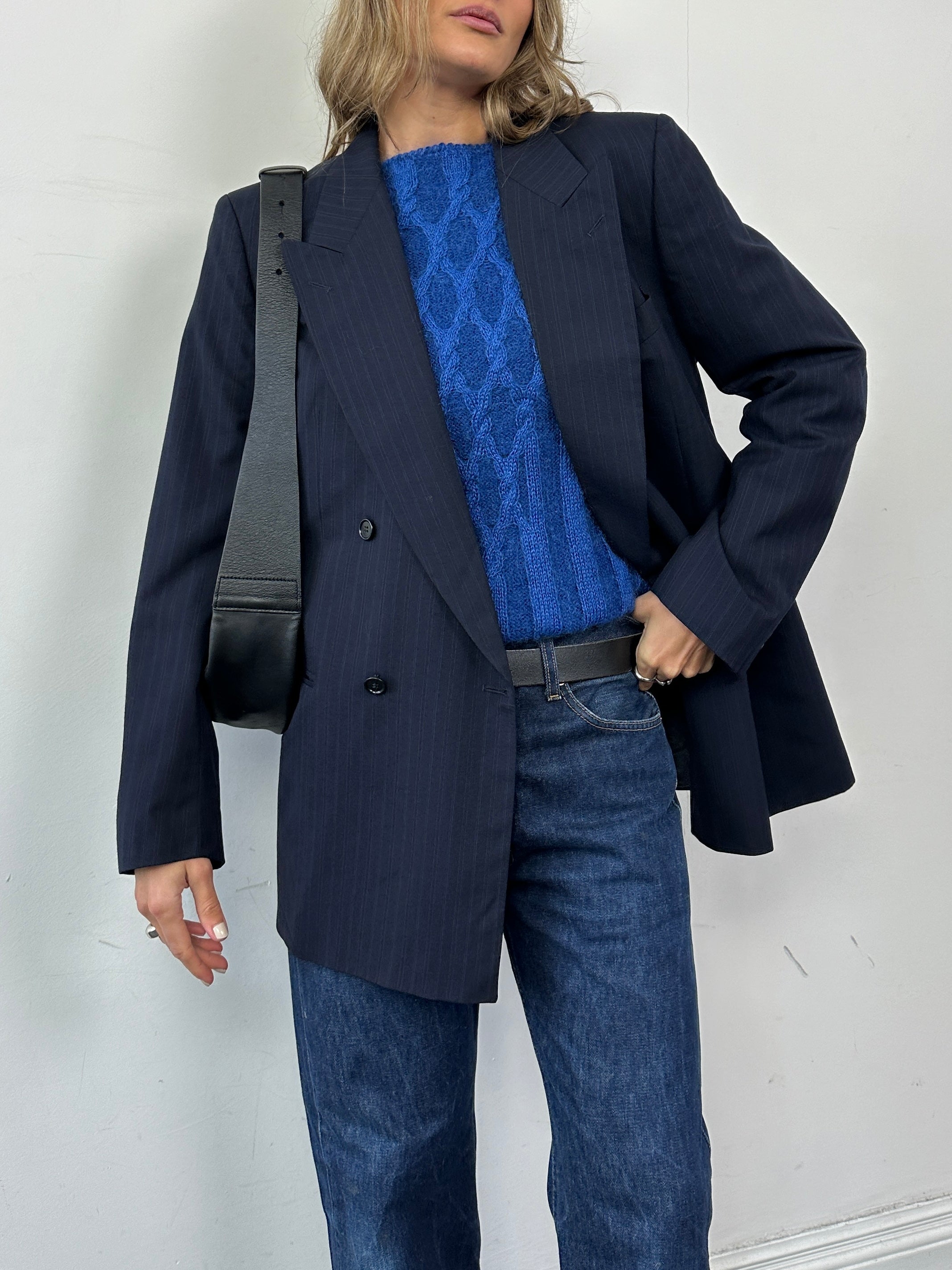 Hugo Boss pinstripe pure wool double-breasted blazer in size L, tailored fit with notch lapels and front buttons.