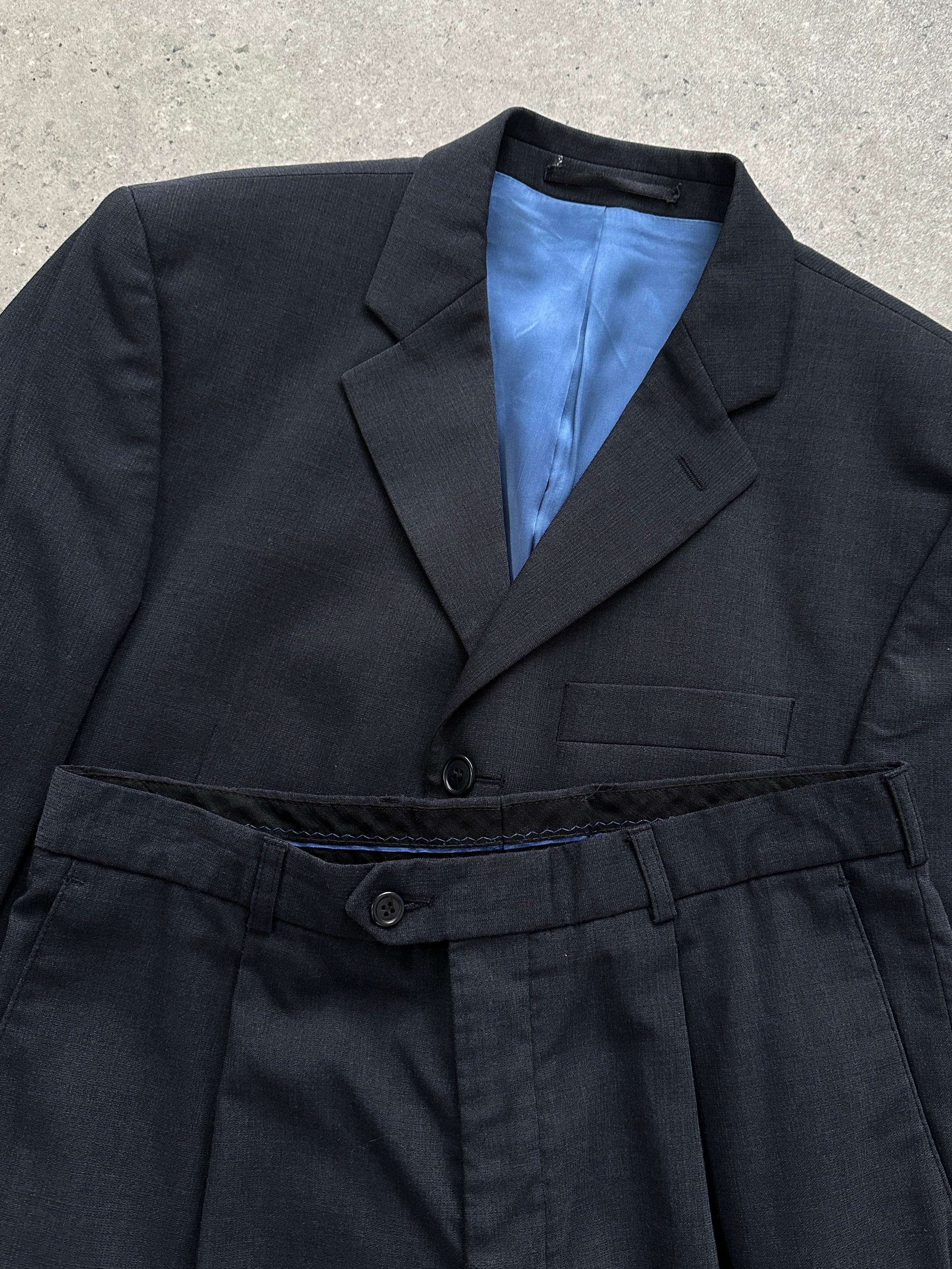 Vintage wool single-breasted suit jumpsuit in size 38R/W30, tailored fit with classic lapel and button closure.