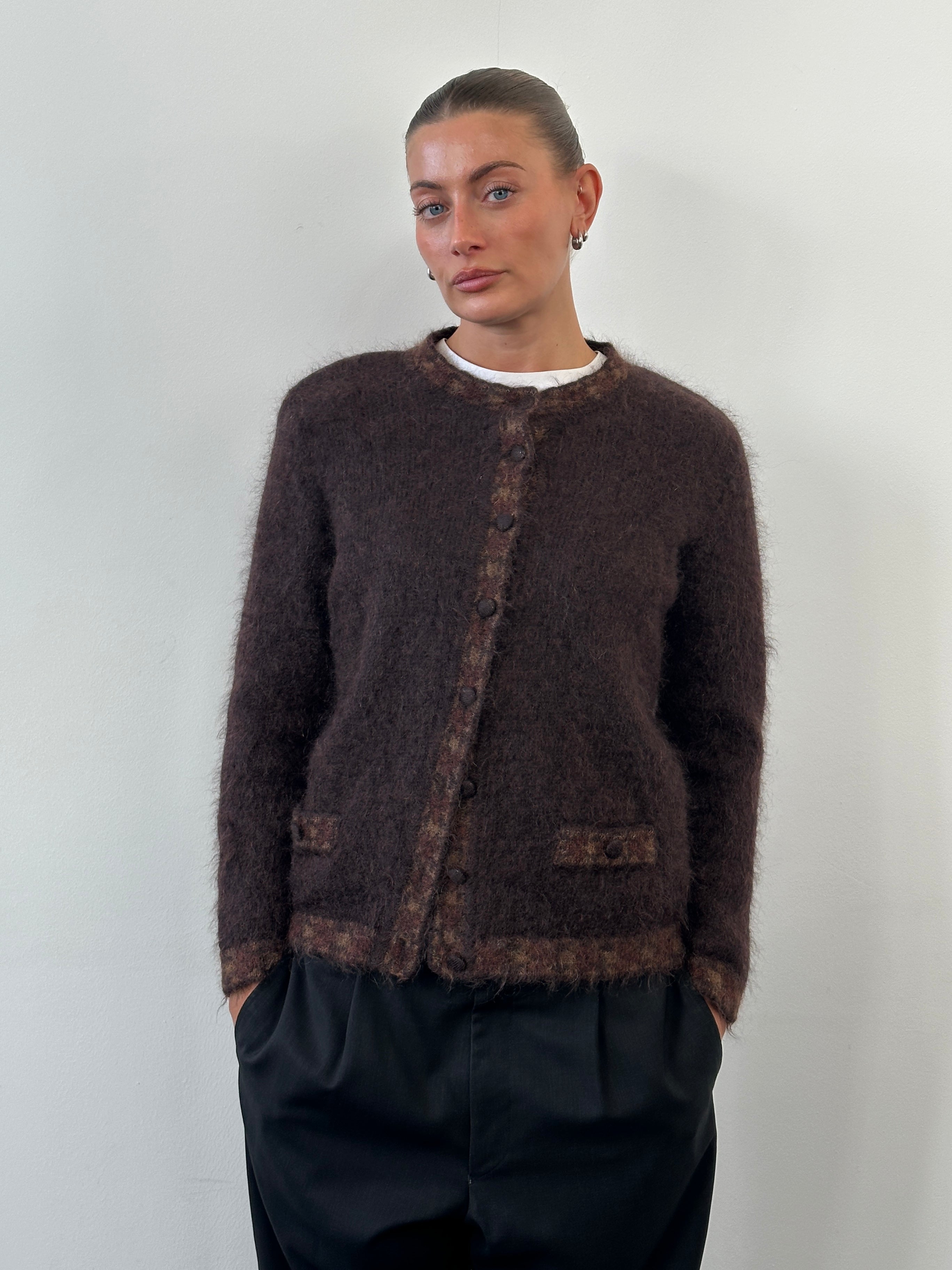 Vintage Italian 1990s mohair cardigan in S/M, featuring a soft, textured knit with a classic button-up design and ribbed cuffs.