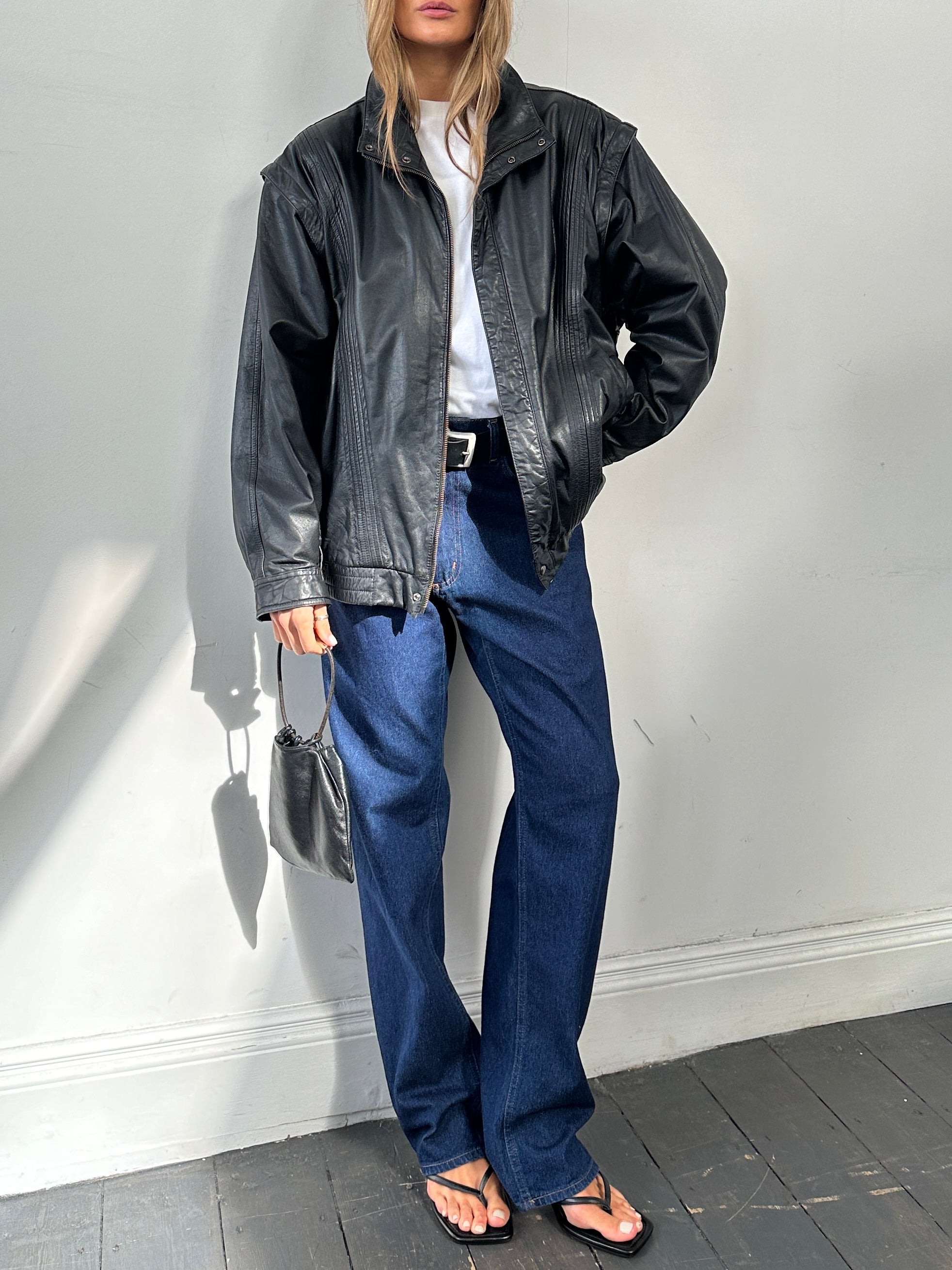 Vintage leather bomber gilet jacket in XL, showing the classic design and textured leather exterior.