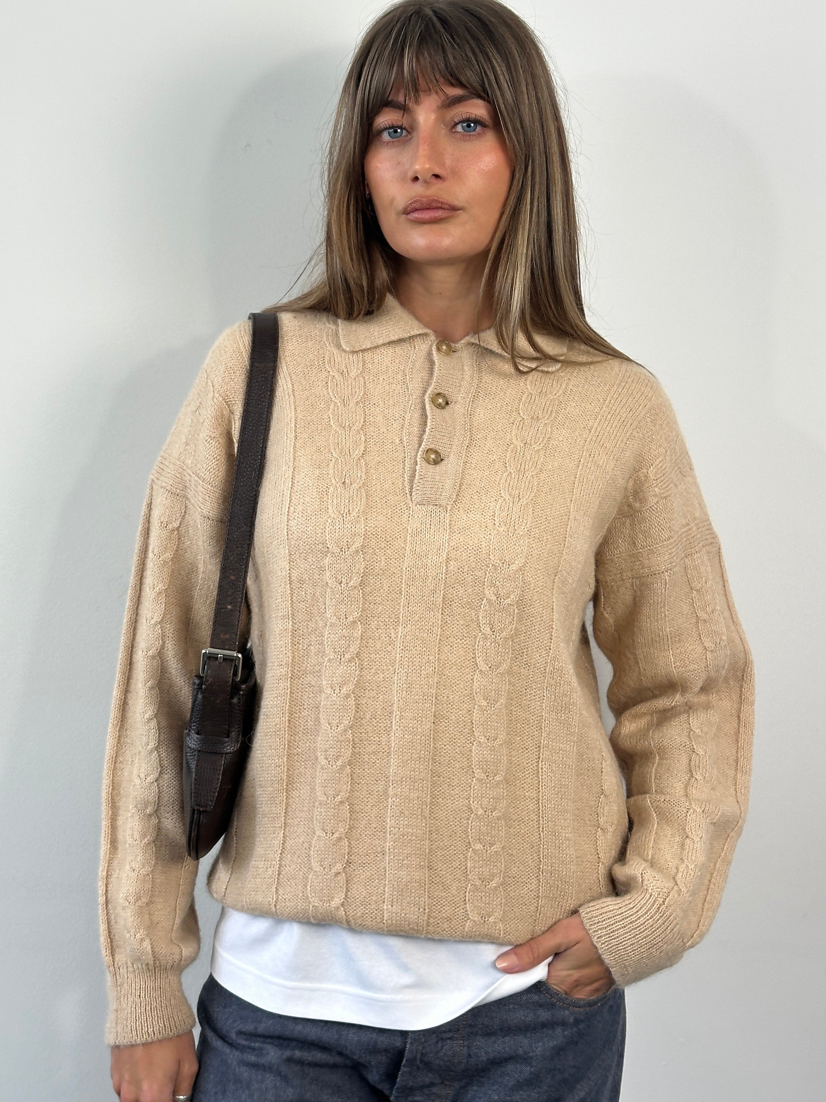 Vintage 1980s wool mohair knitted polo jumper in size M, showcasing a classic retro design with textured knit pattern.