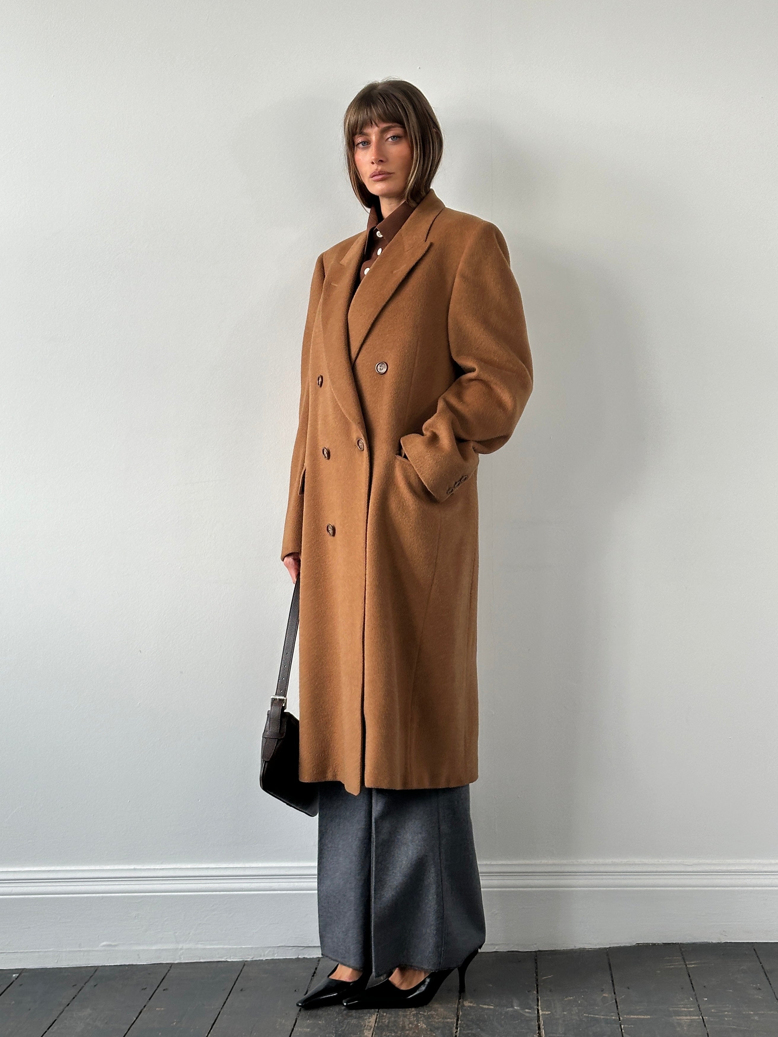 Vintage Italian 1980s pure cashmere double-breasted coat in XL with classic design and rich texture, displayed on a hanger.