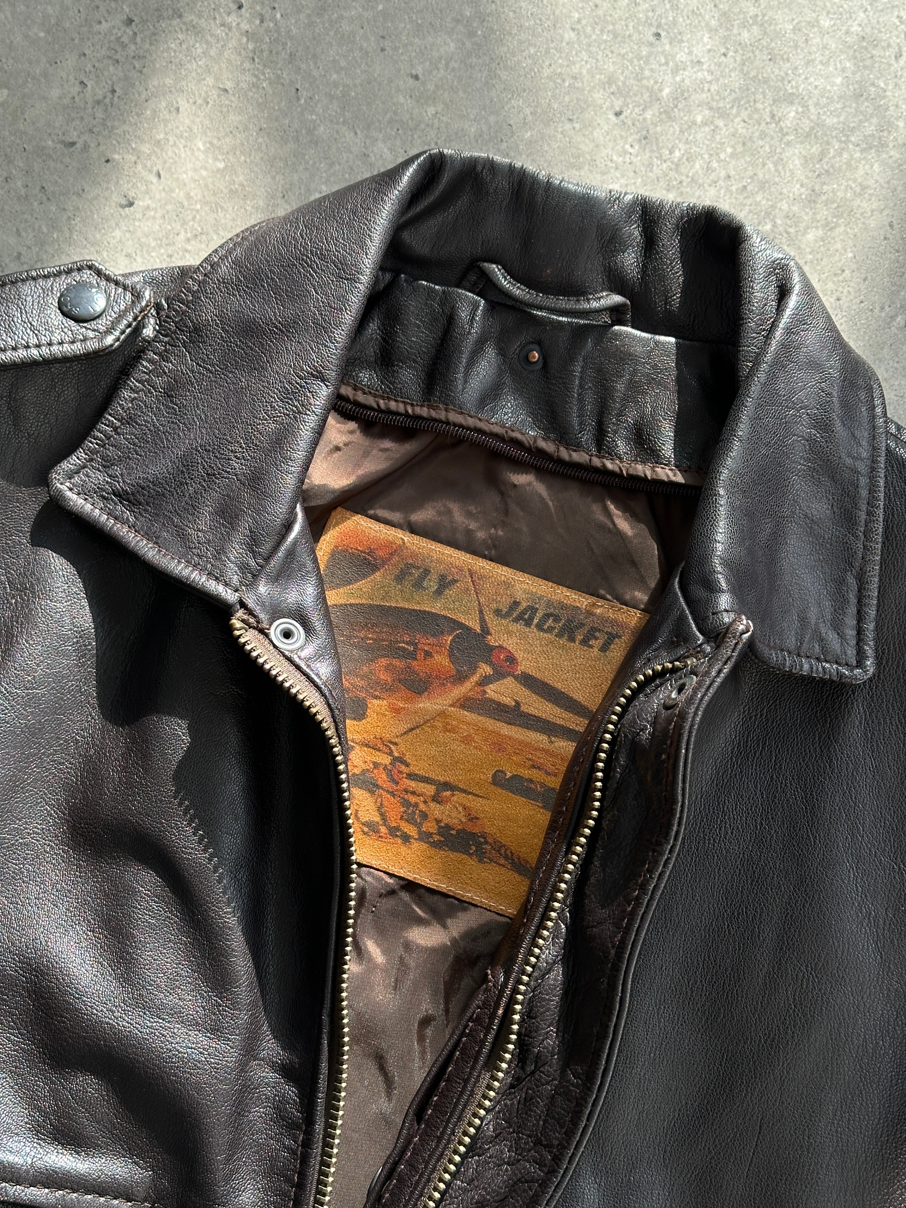Vintage leather bomber jacket with removable faux fur lining, size S/M, stylish and warm outerwear.