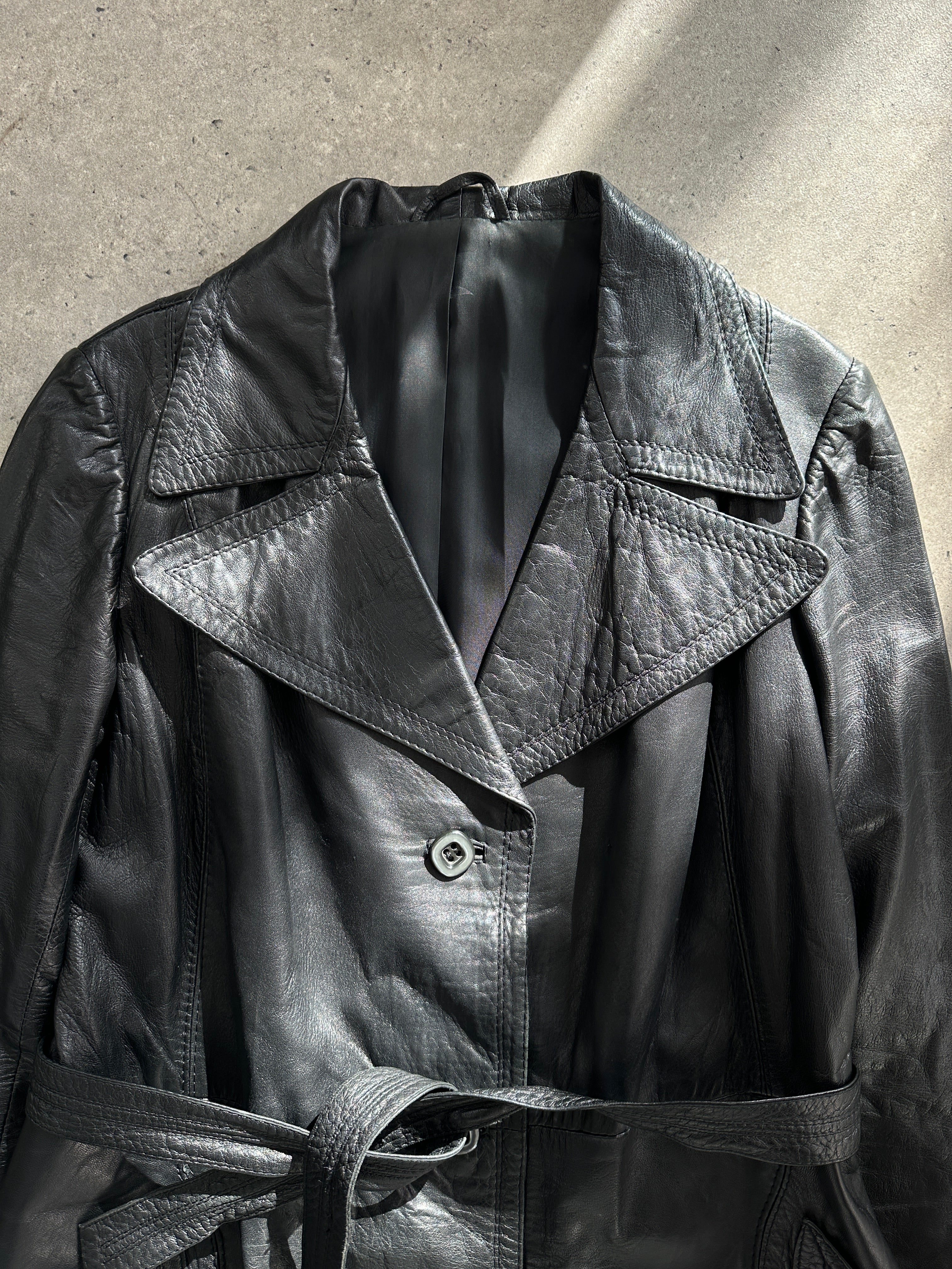 Vintage Italian vintage leather belted trench coat for women, featuring classic design and durable leather material.