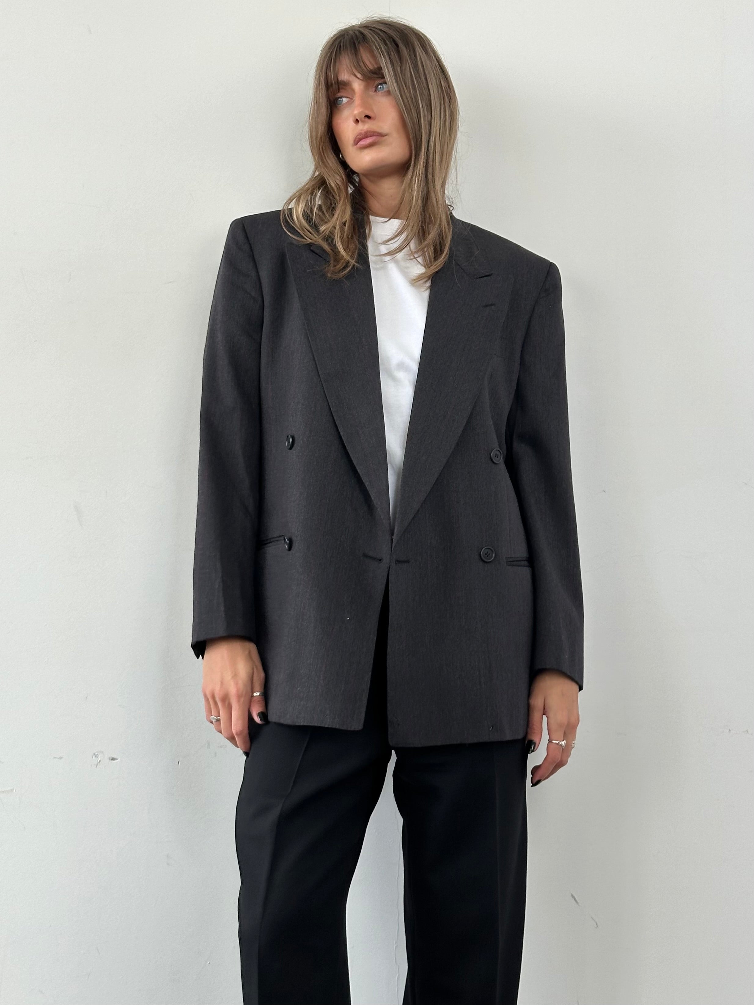 Valentino virgin wool double-breasted blazer in size 36R, tailored fit, with classic lapels and button details.
