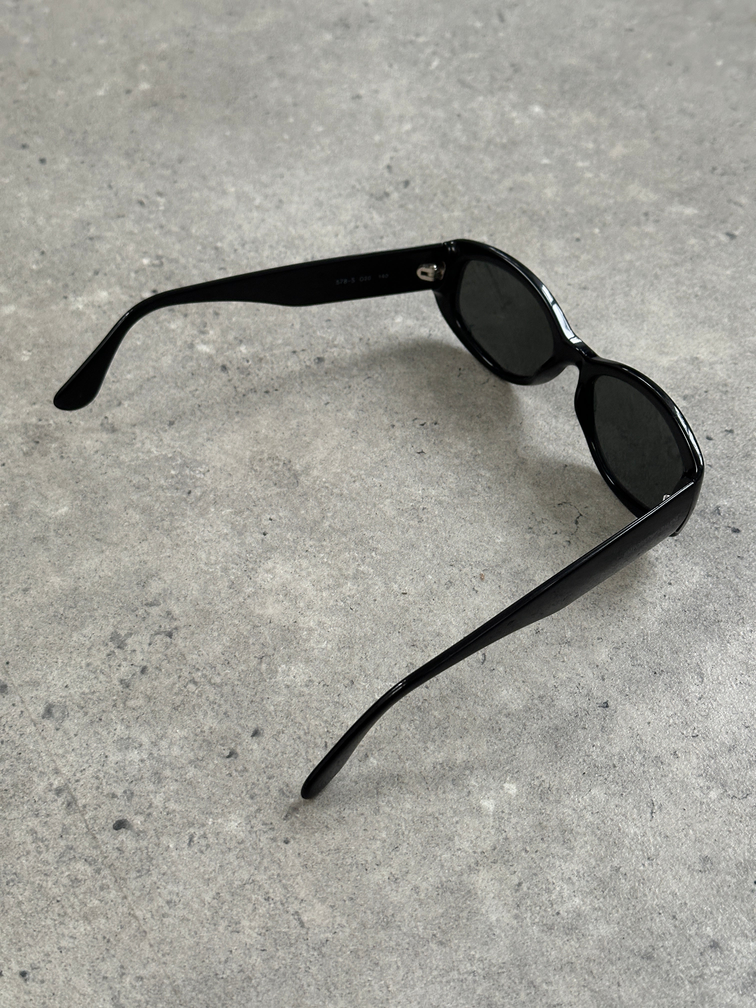 Emporio Armani 2000s oval sunglasses with dark lenses and sleek black frames, stylish eyewear for a modern look.