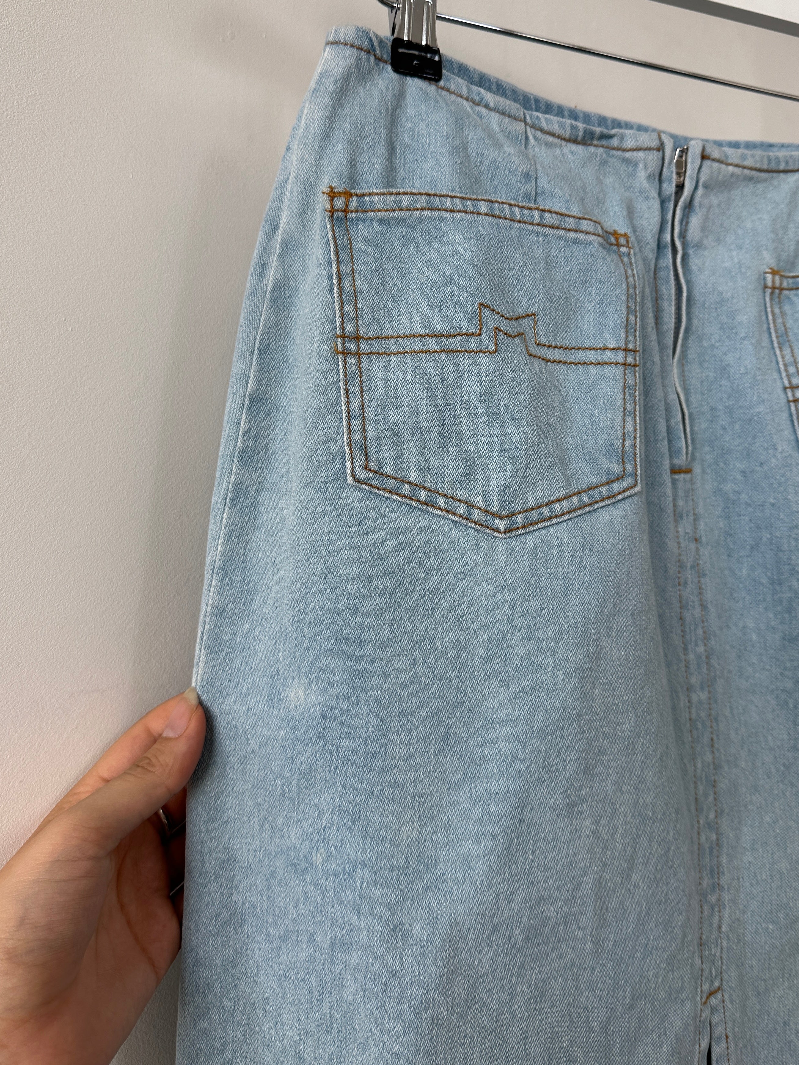 Max Mara pure cotton denim midi skirt with a high waist and classic five-pocket design, shown in a light blue color.