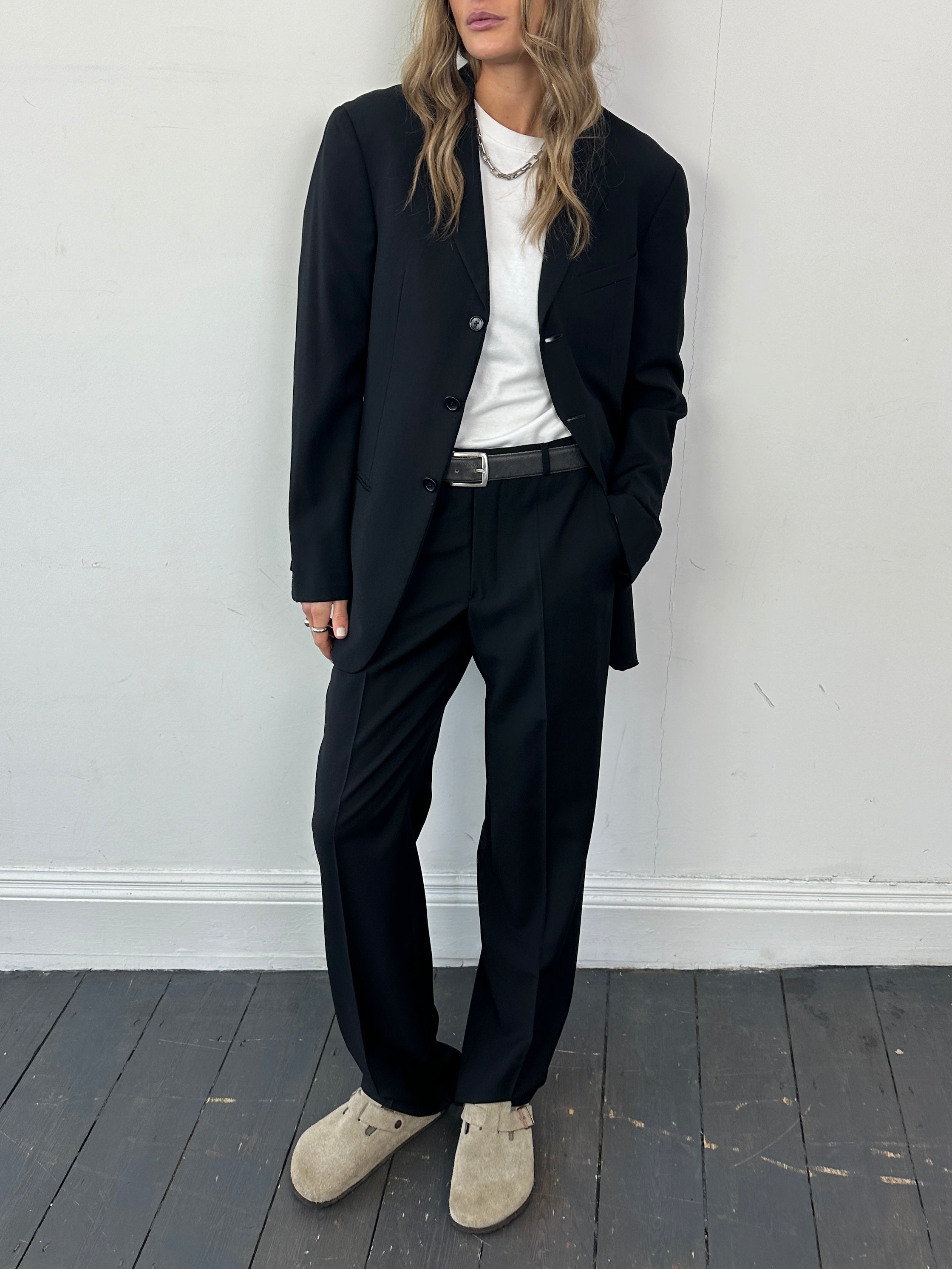 Armani jumpsuit in pure wool, single-breasted design, size 38R/W30, tailored fit with lapel collar and front button closure.
