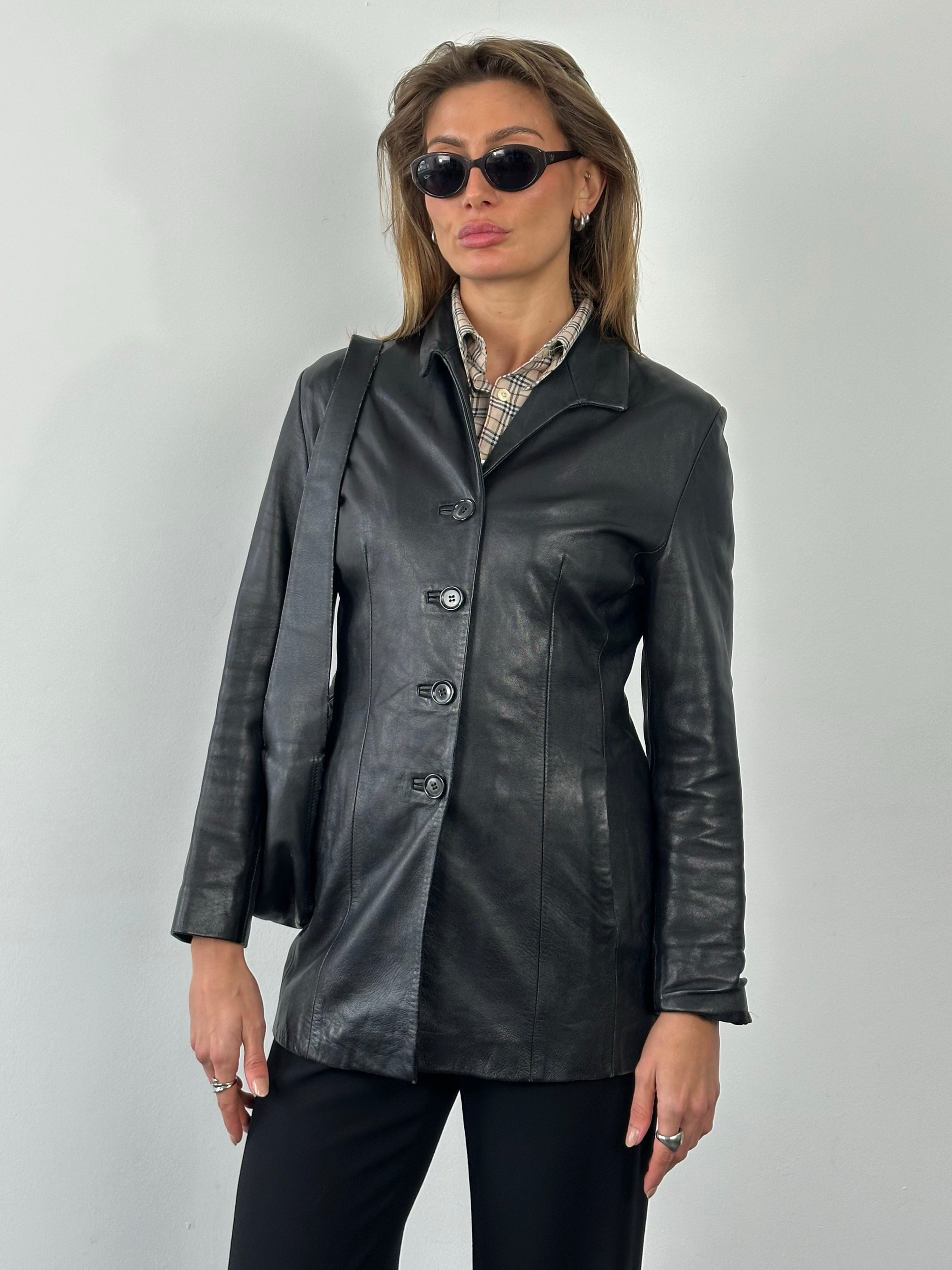 Vintage British 1990s fitted leather jacket, small size, shown with classic collar and zip front, made from genuine leather.