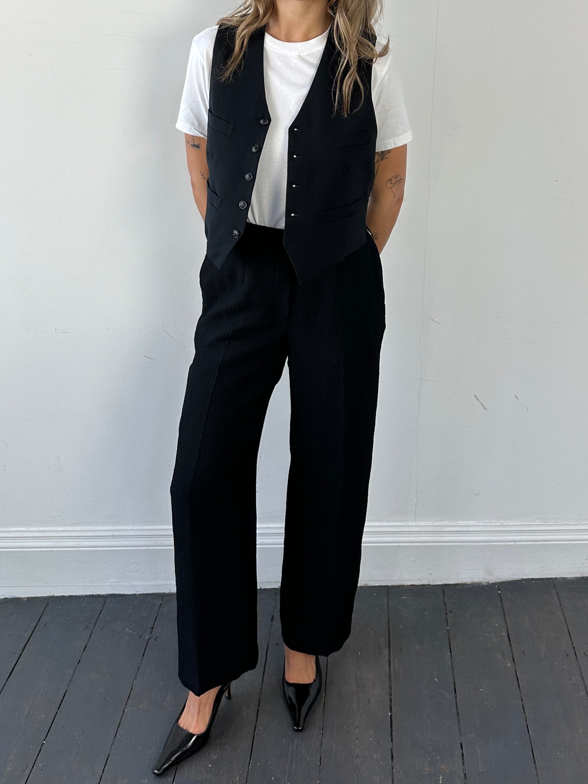 Vintage high waisted textured trousers in W26, showing the detailed fabric and classic fit on a neutral background.
