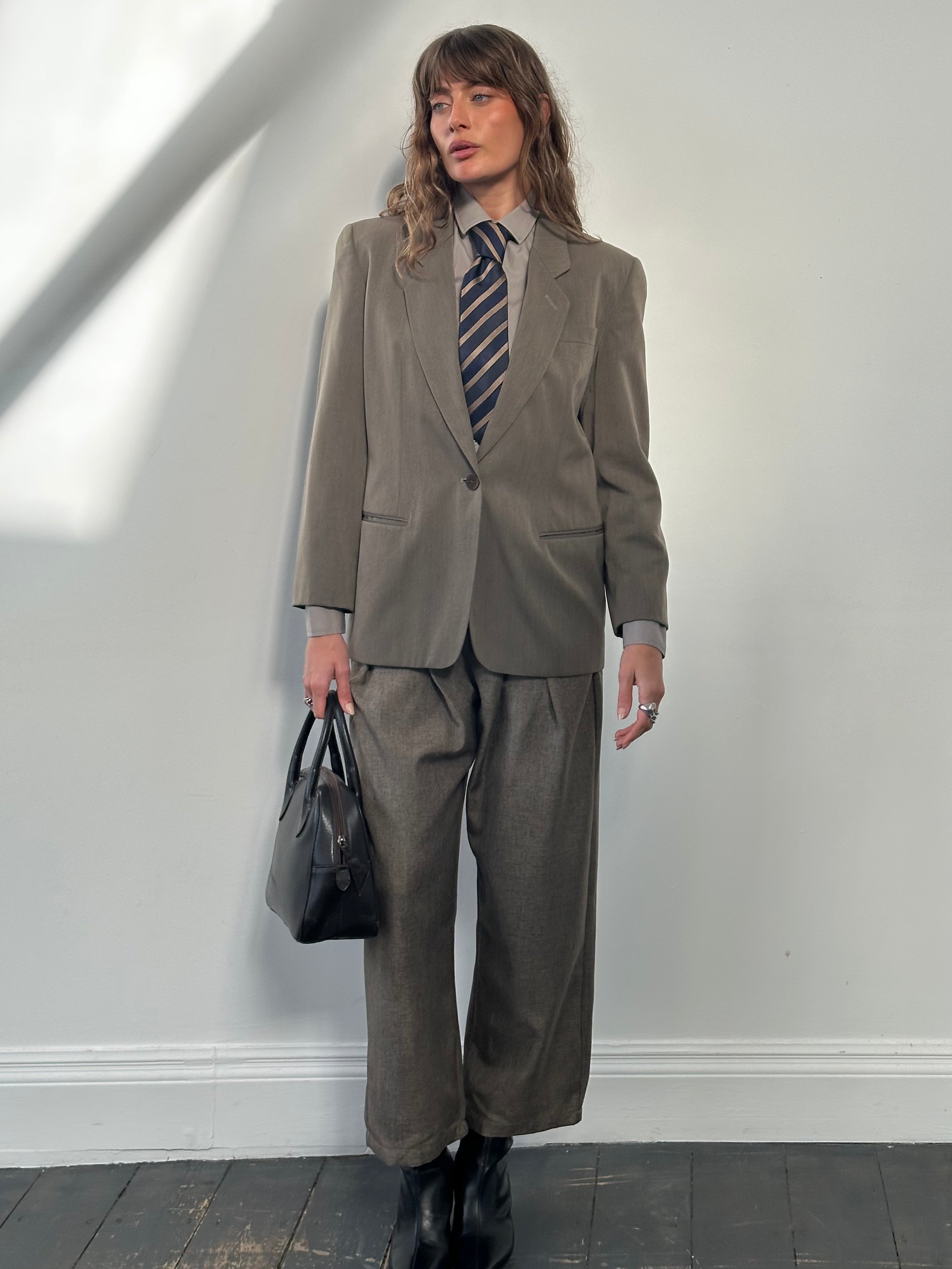 Mani 1990s wool blazer in size S featuring a single button, tailored fit, and classic design, shown on a neutral background.