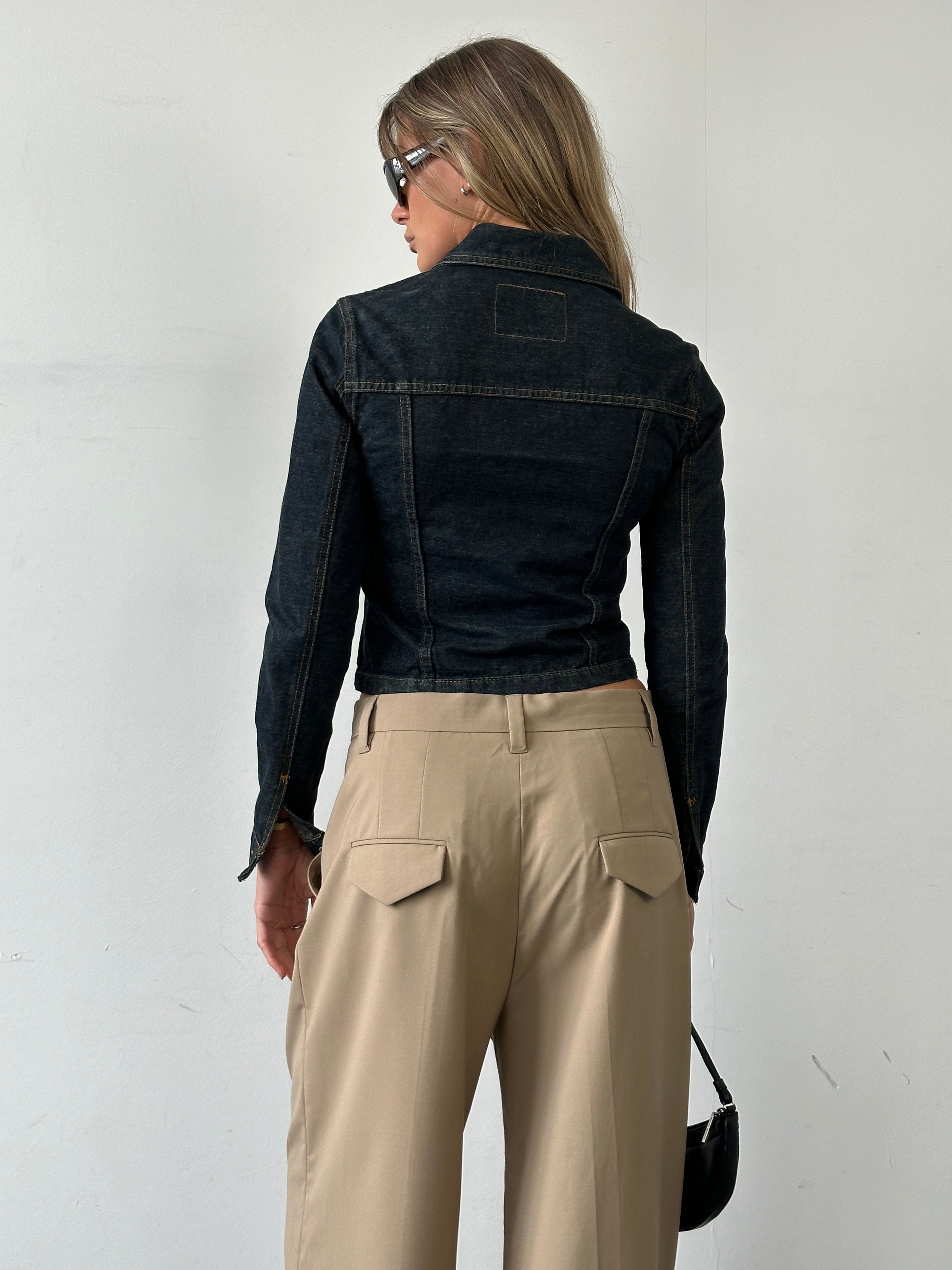 Vintage Italian raw denim fitted jacket in XS/S, showcasing classic distressed texture and tailored fit, front view.