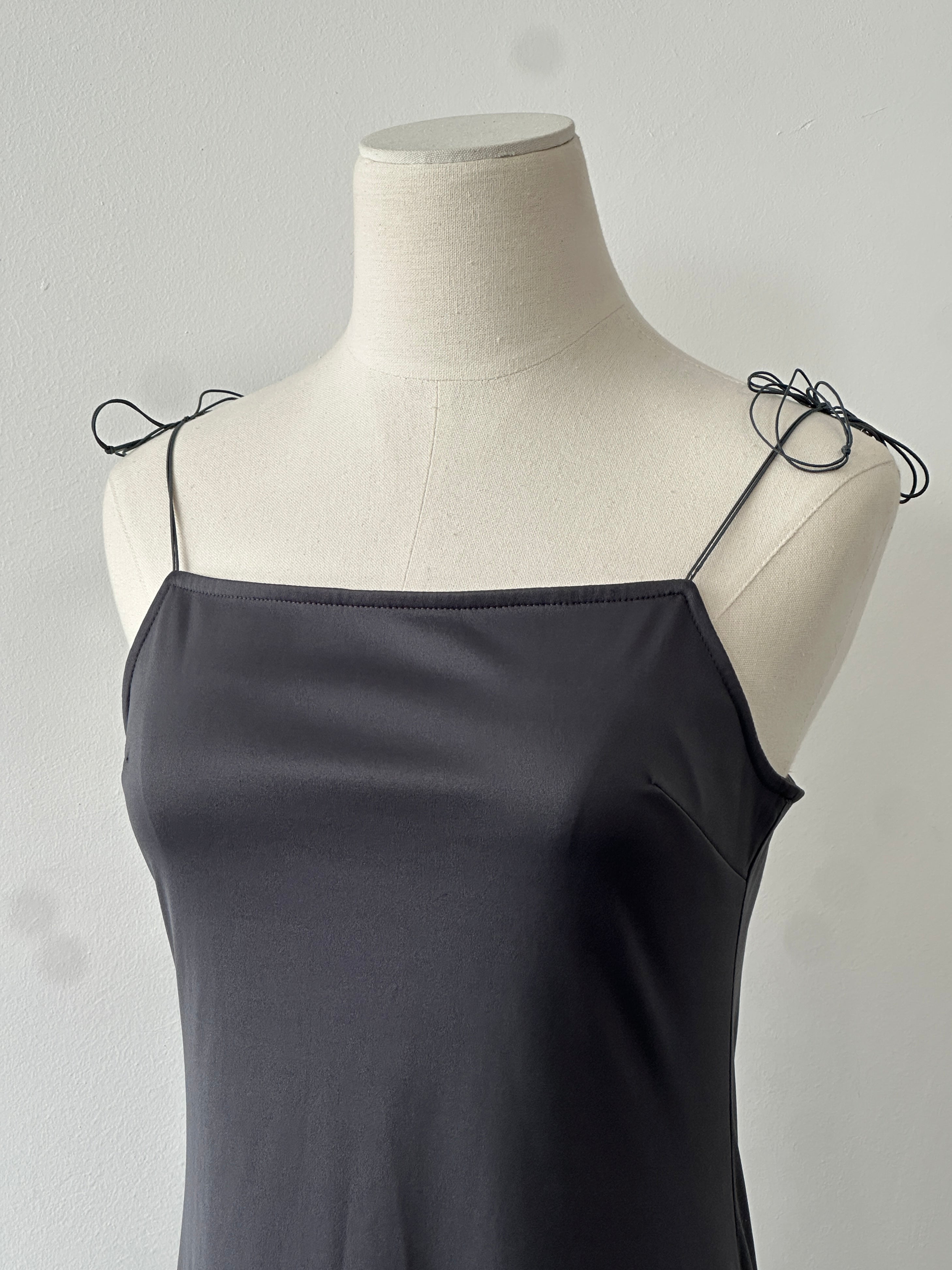 Vintage 1990s square neck satin midi slip dress in navy, sleeveless with a fitted silhouette and elegant fabric finish.