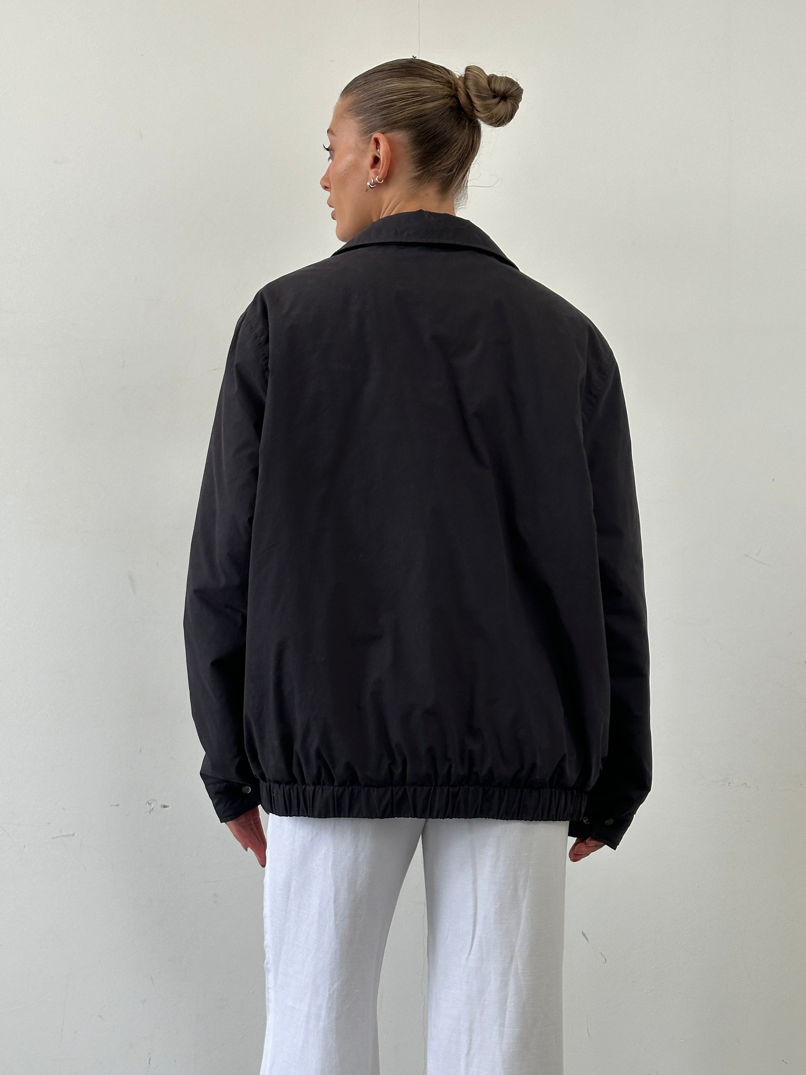 Yves Saint Laurent Pour Homme padded logo bomber jacket in XL, black with Yves Saint Laurent branding and front zip closure.
