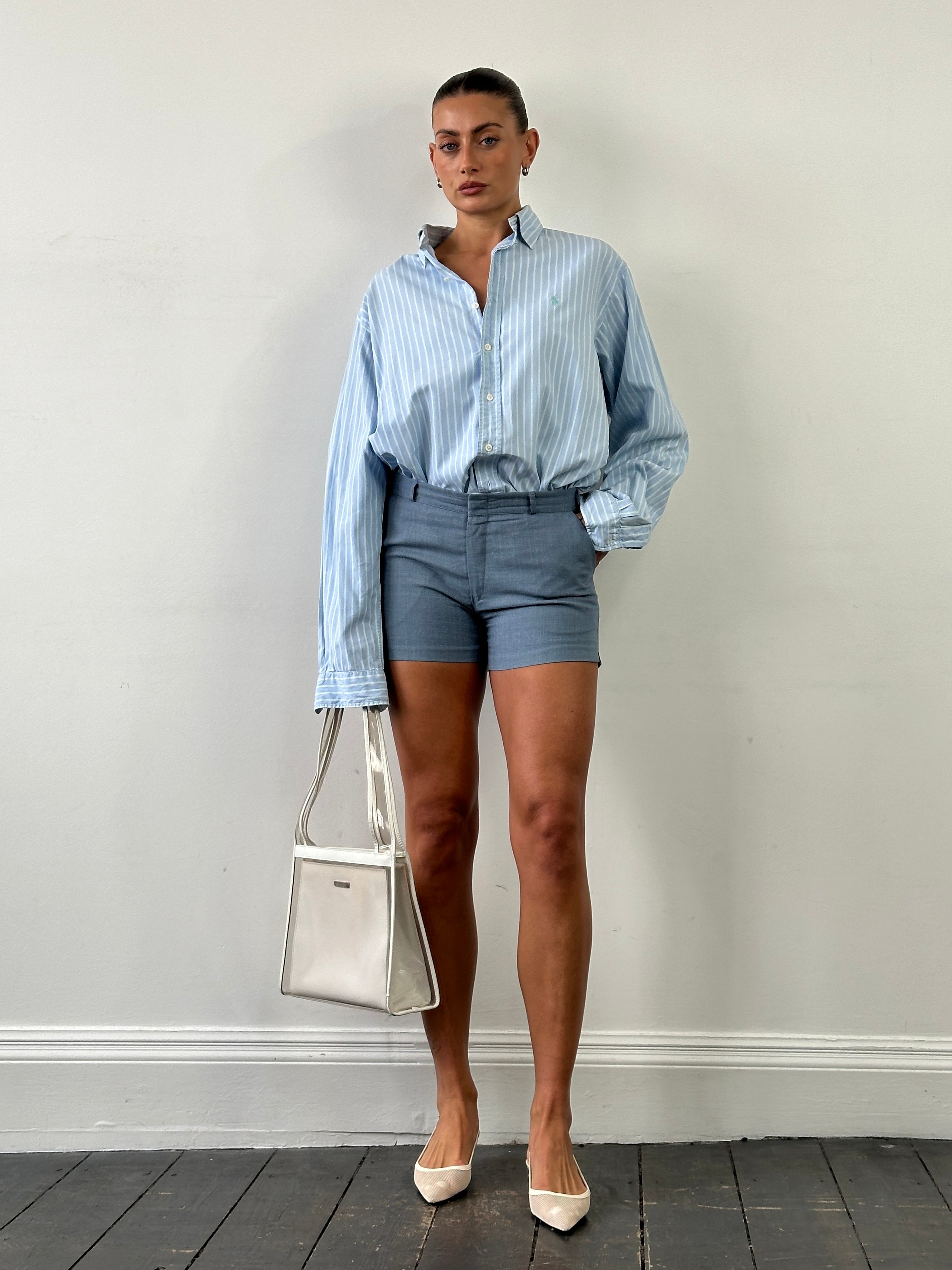 Vintage brand vintage low-mid waisted tailored mini shorts, W30, with structured fit and classic design, shown from the front.