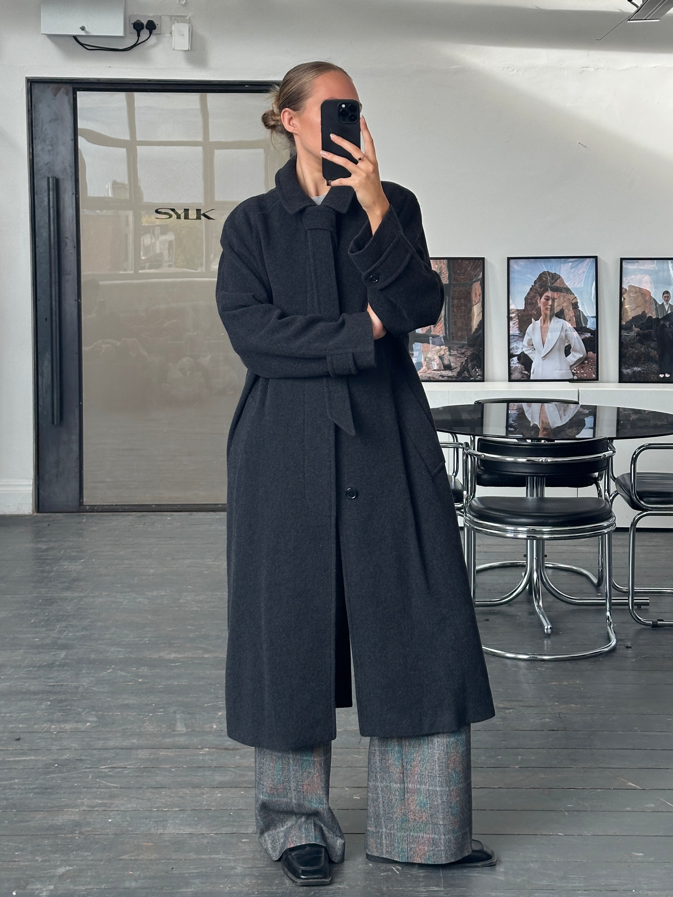 Vintage 1990s wool cashmere belted coat in size L/XL, featuring a classic design and warm, textured fabric.