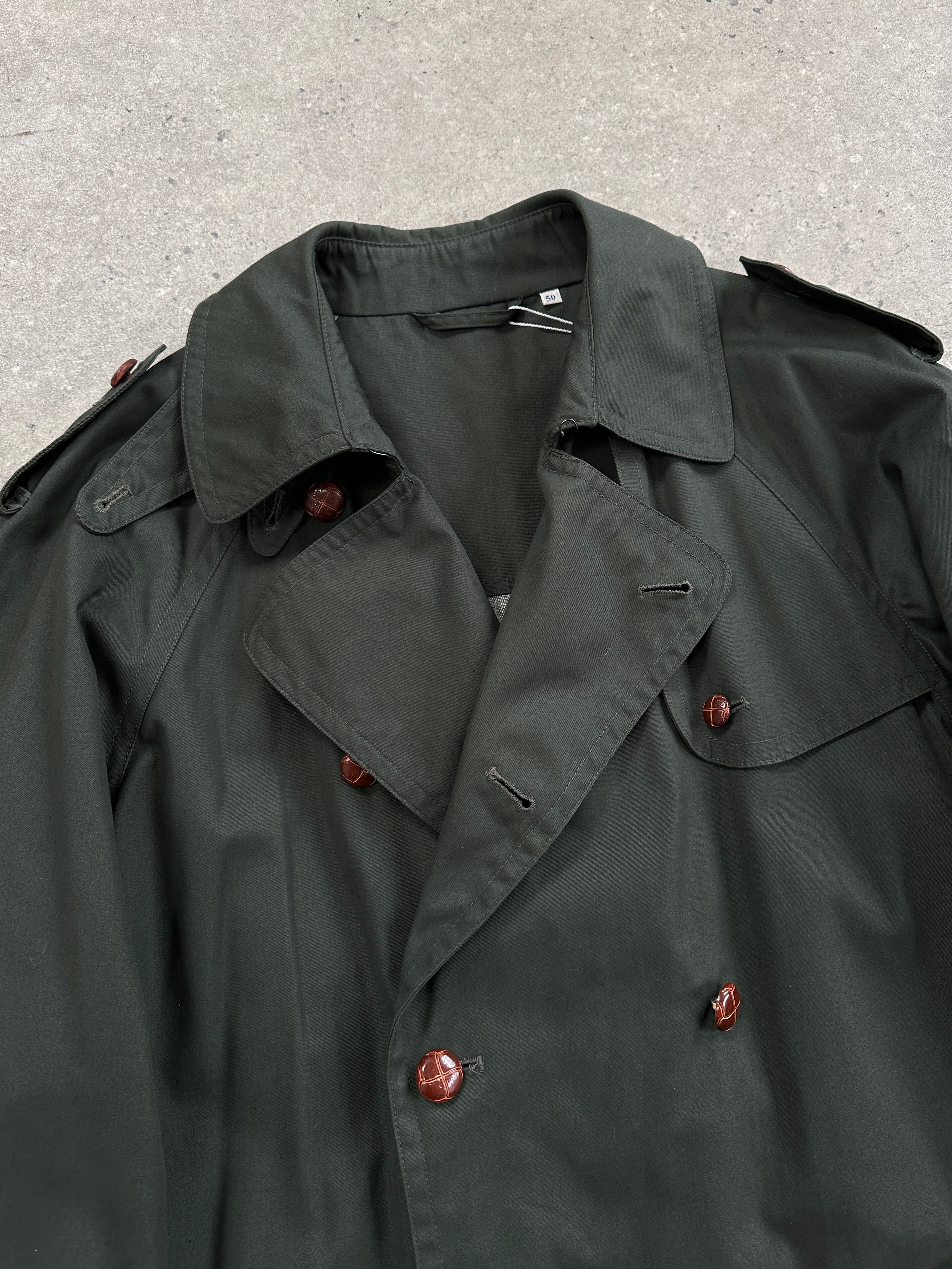 Vintage double-breasted trench coat in XL/XXL size, classic style with belted waist and button details, displayed on a hanger.