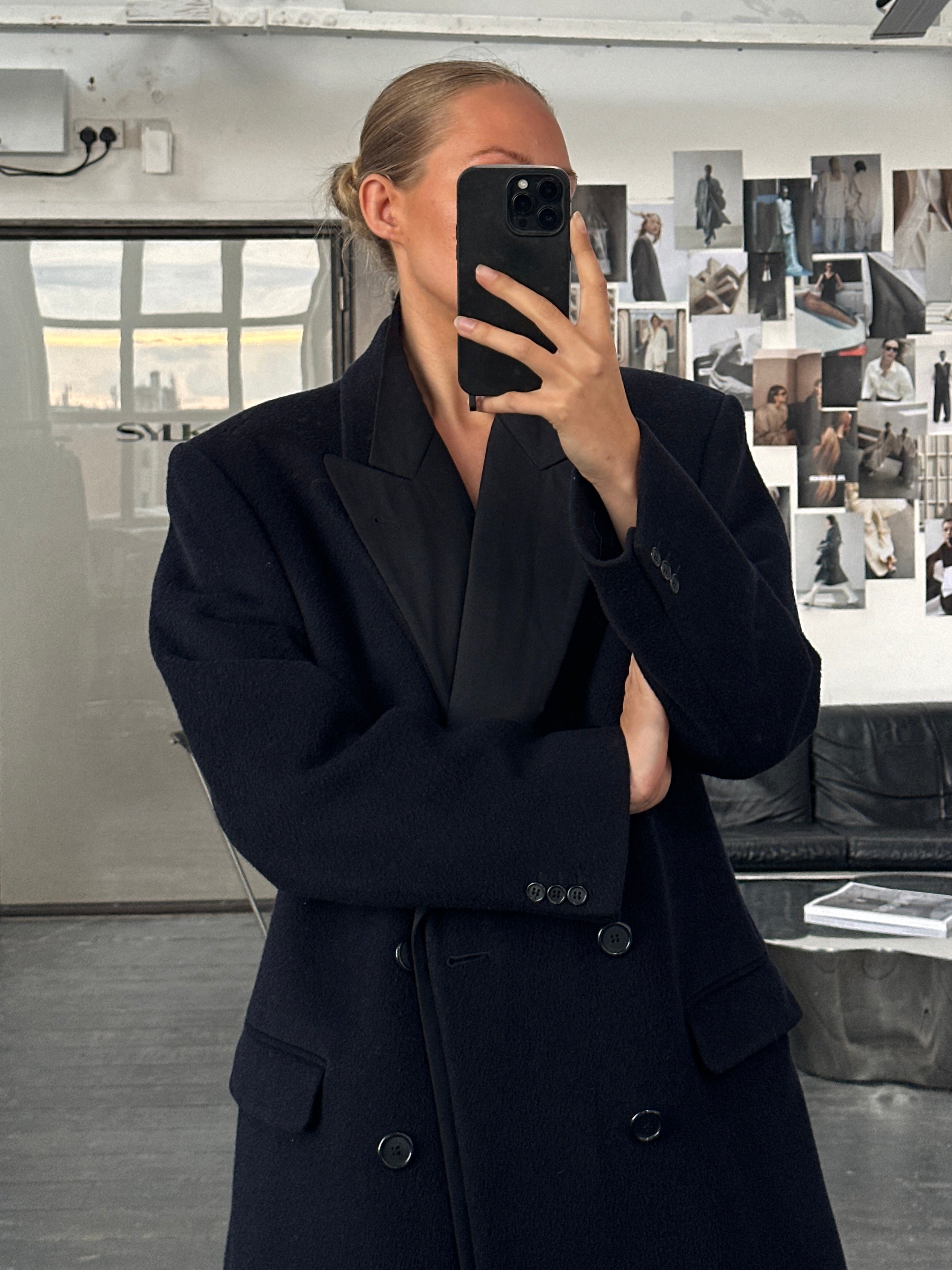 Vintage British 1990s wool cashmere double-breasted coat in XL, featuring classic tailored design and warm, textured fabric.