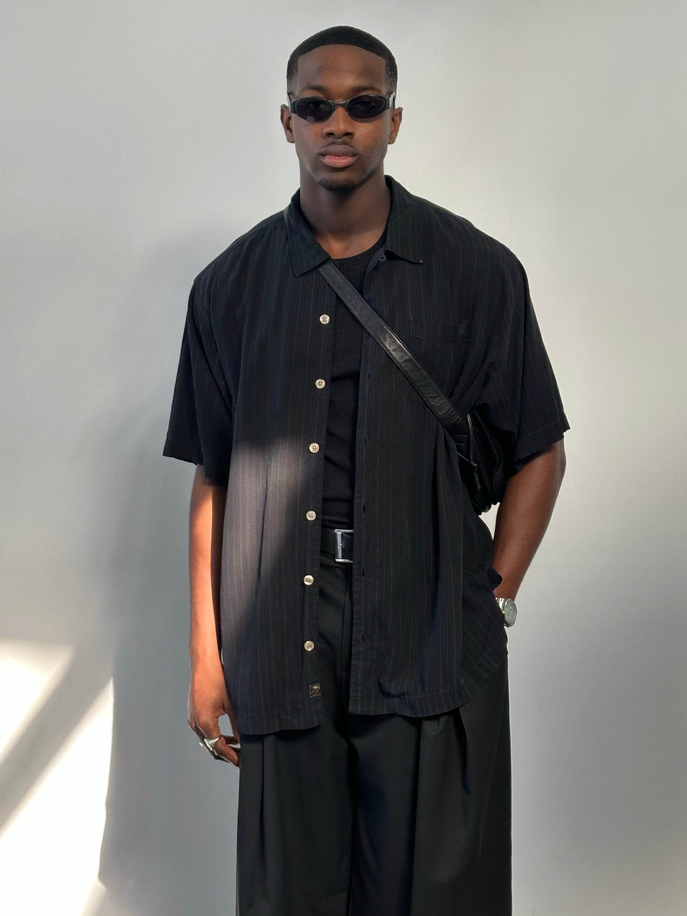 Vintage 2000s pure silk relaxed short sleeve shirt in XL, featuring soft fabric and classic design, shown on a hanger.