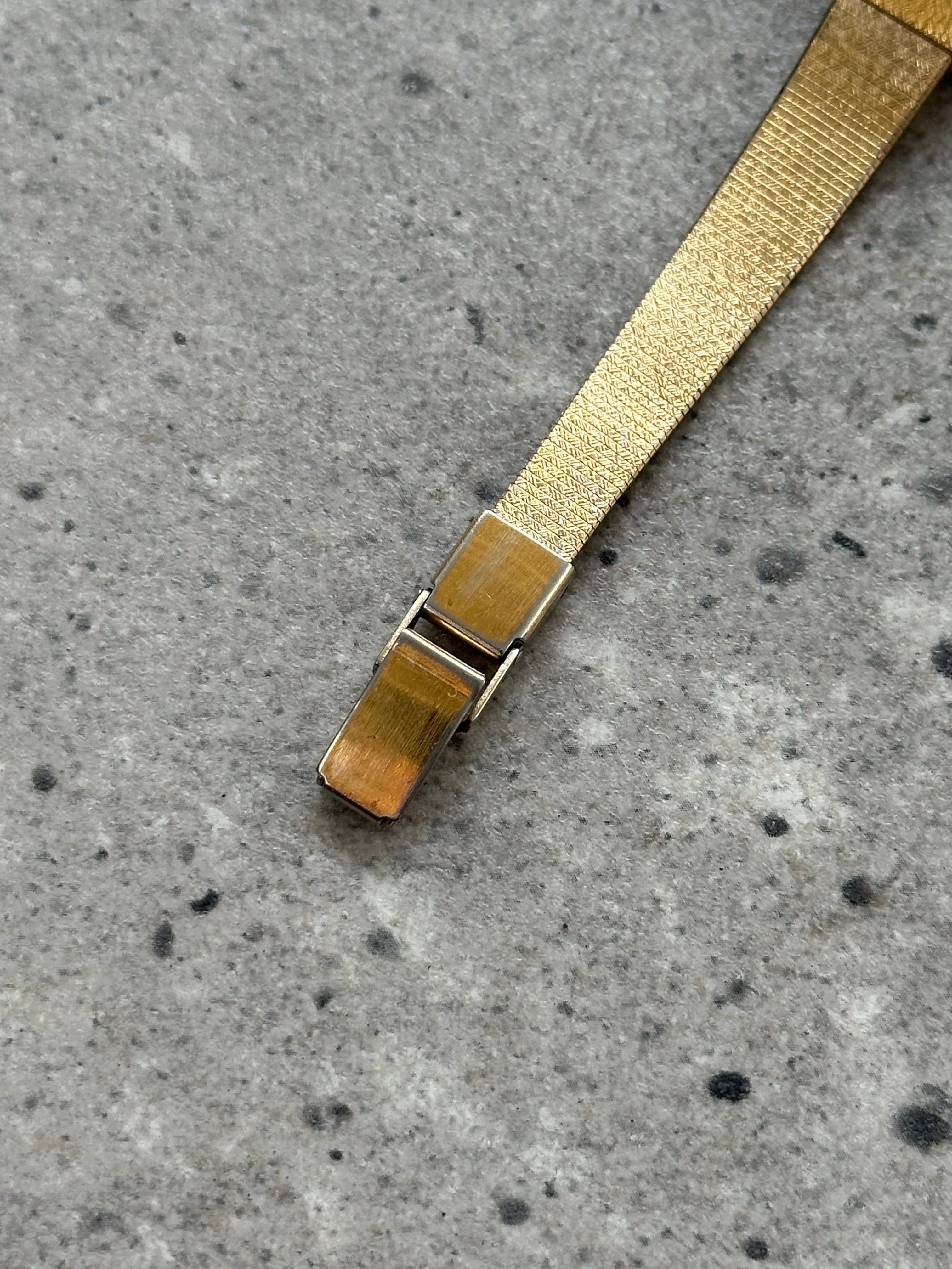 Accurist 1990s gold-tone octagonal quartz watch with a sleek design and metallic finish.
