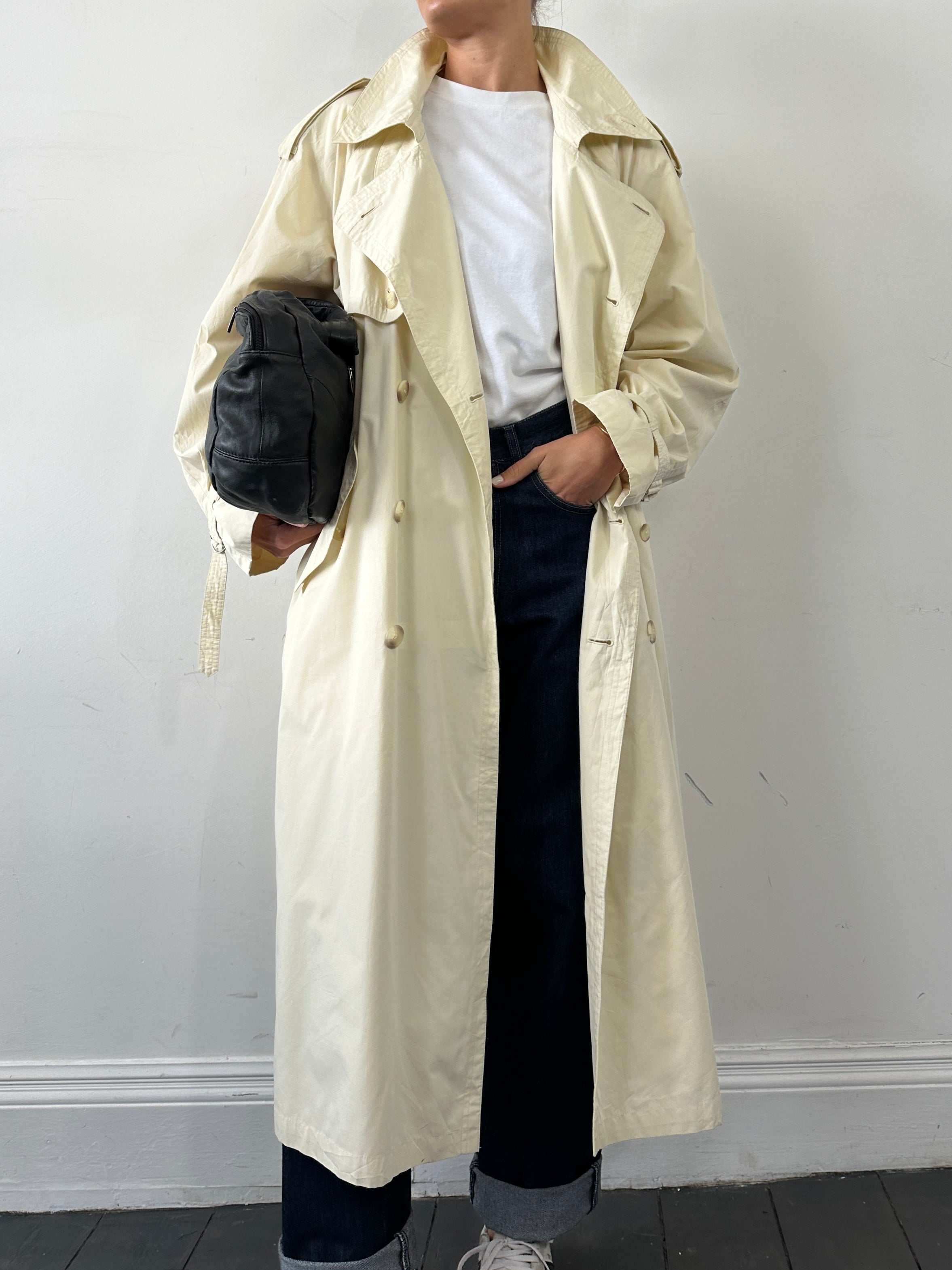 Yves Saint Laurent Pour Homme trench coat in XL/XXL, stylish men's coat with classic design and tailored fit, shown on a hanger.