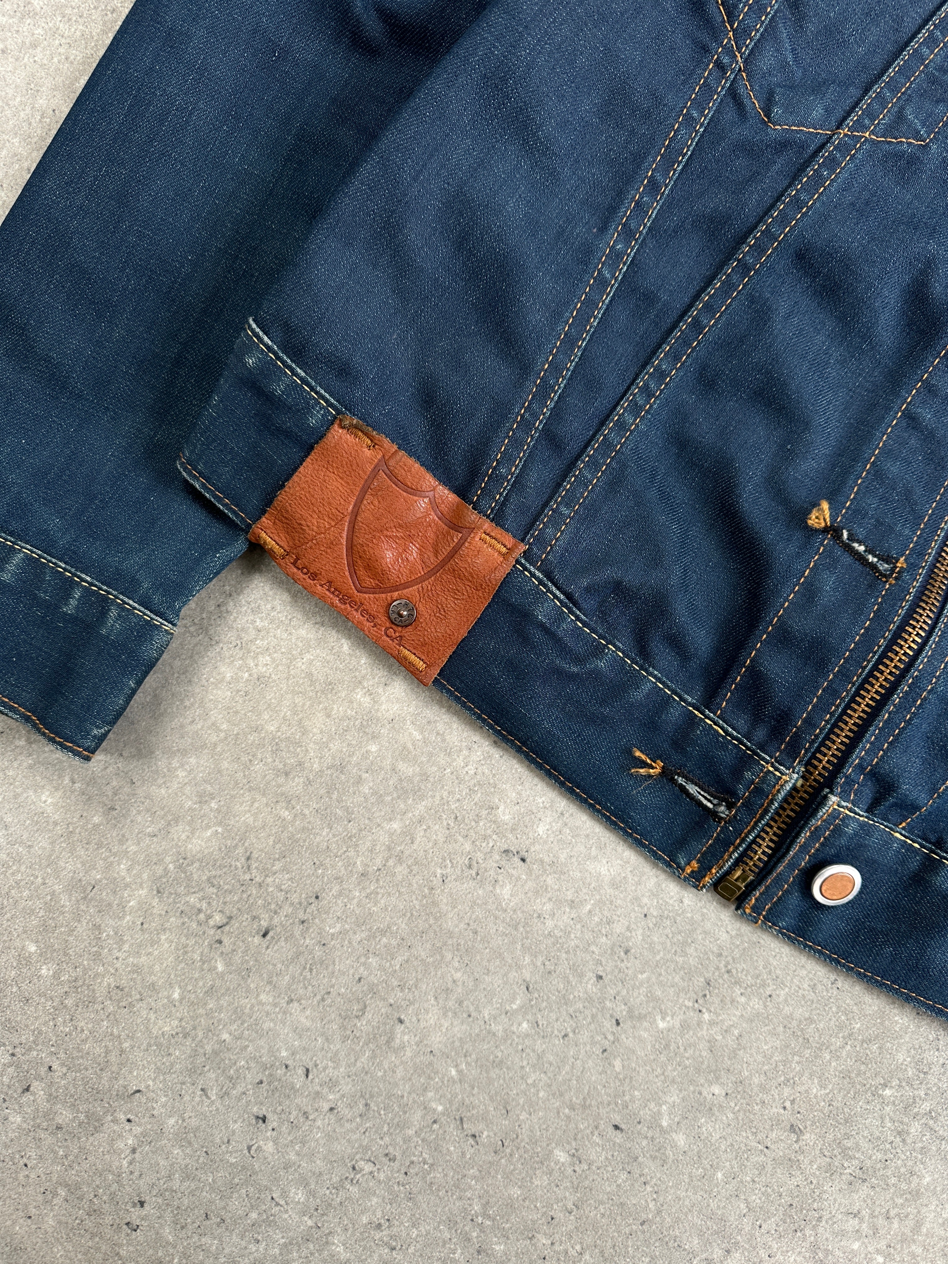 Vintage Hollywood Trading Company HTC 2000s Night Flyer moto denim jacket in size S, displayed on a hanger with detailed stitching.