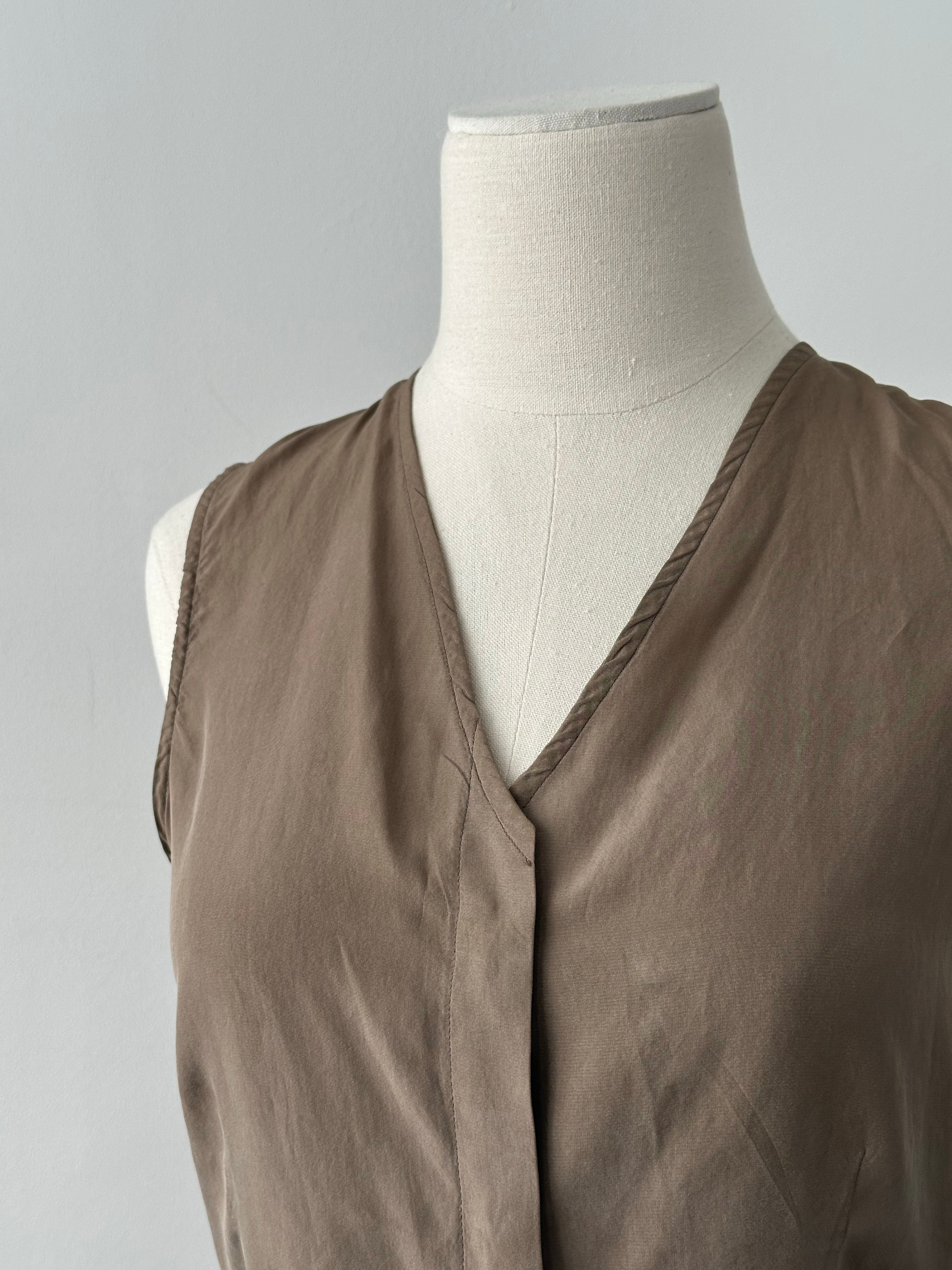 Emporio Armani 2000s pure silk sleeveless top in minimal style, showcasing a sleek, sleeveless design in a light color.